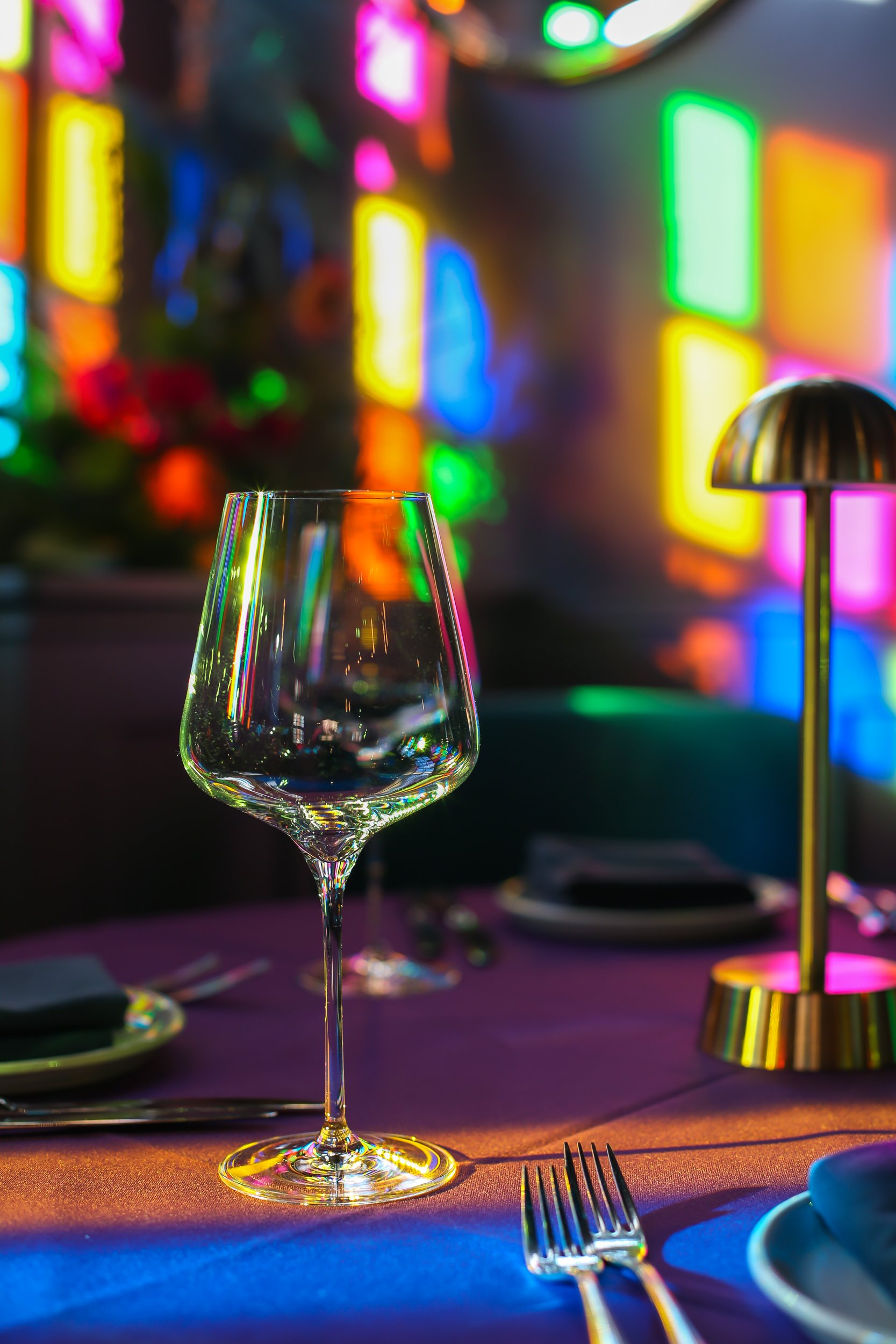 wine-glass-coloured-by-stained-window-the-dilli-indian-haslemere.jpg
