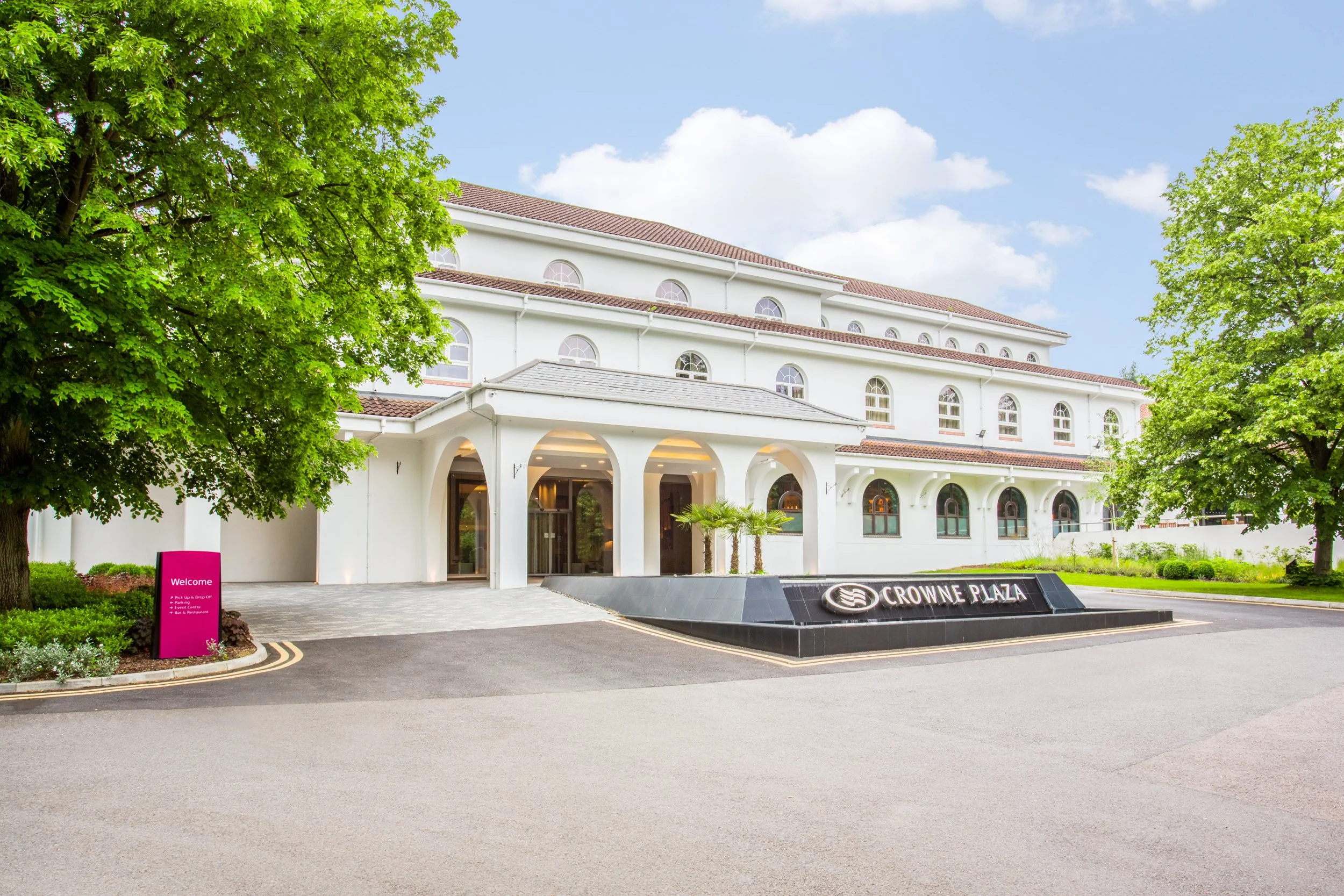 Evening exterior of Crowne Plaza hotel in Gerrards Cross