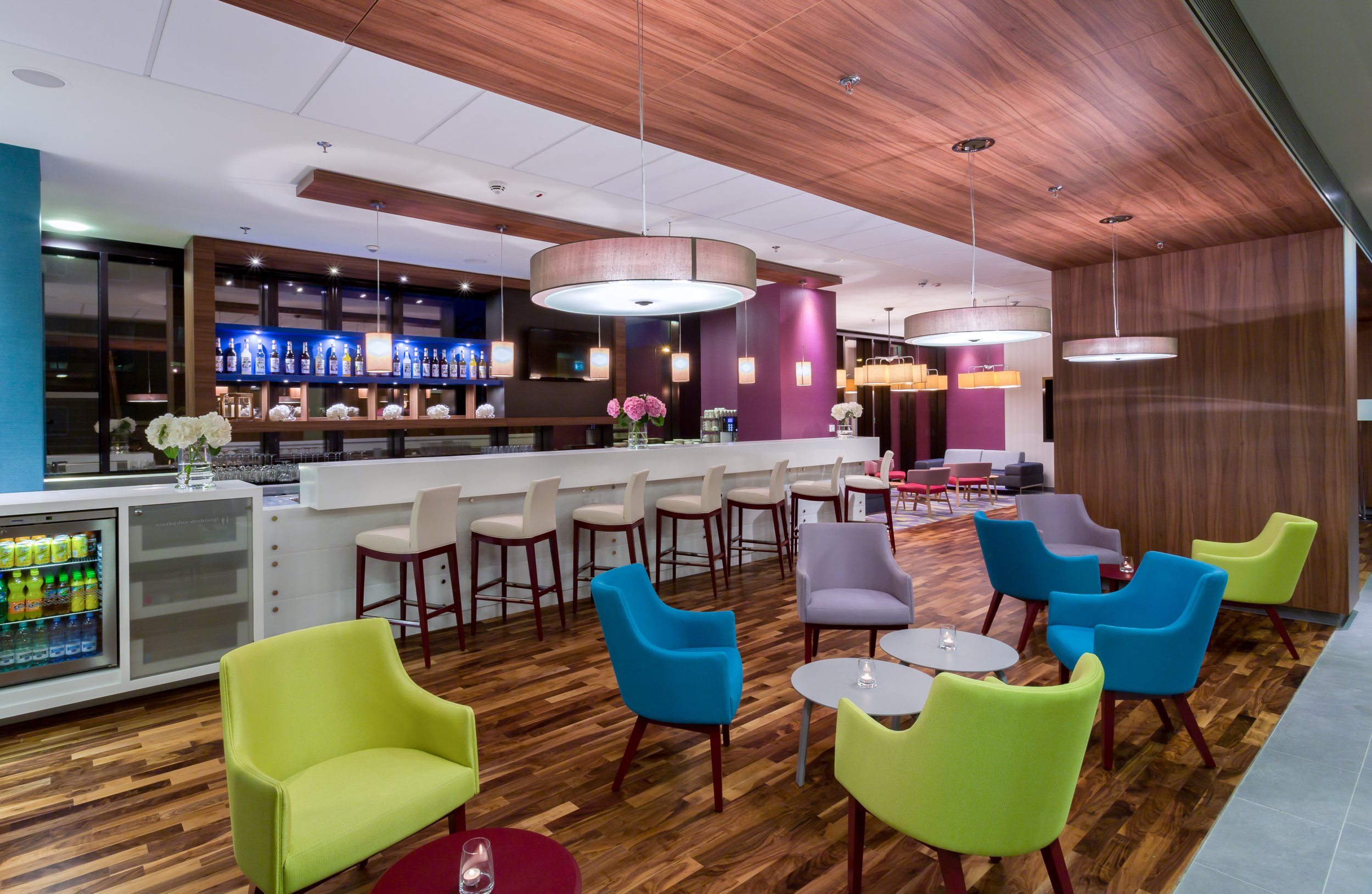 Wide evening shot of hotel bar at Hampton by Hilton, Warsaw, Poland