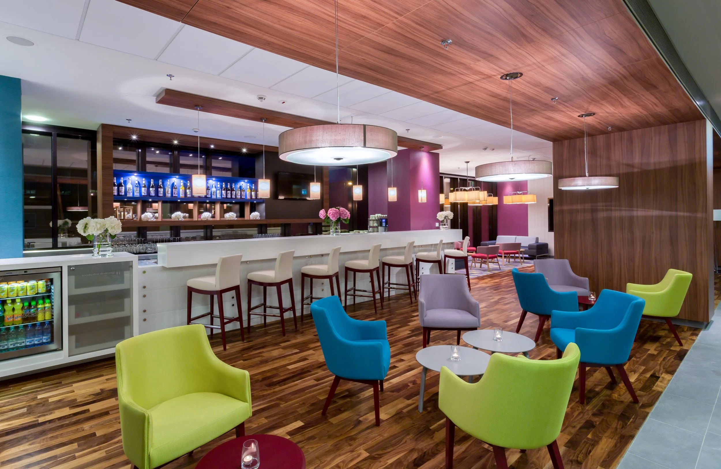 Wide evening shot of hotel bar at Hampton by Hilton, Warsaw, Poland