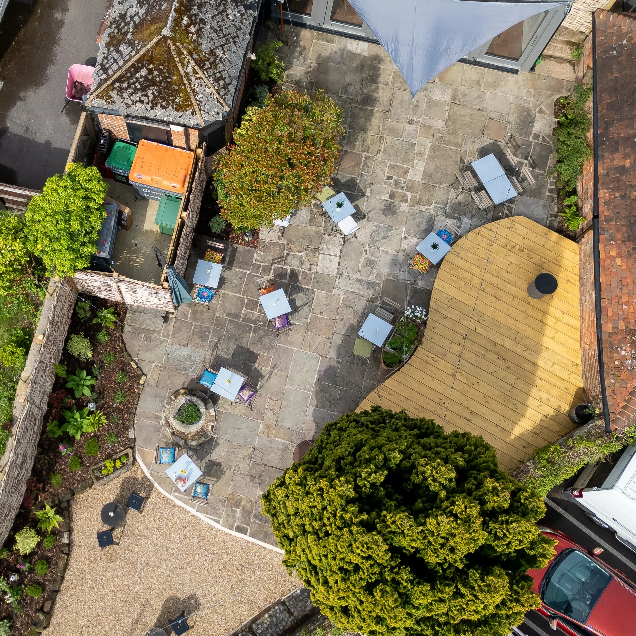 Square cropped drone shot of exterior enclosed courtyard – The Lion's Den Midhurst – Hospitality Venue Photography by Sequoia Studios
