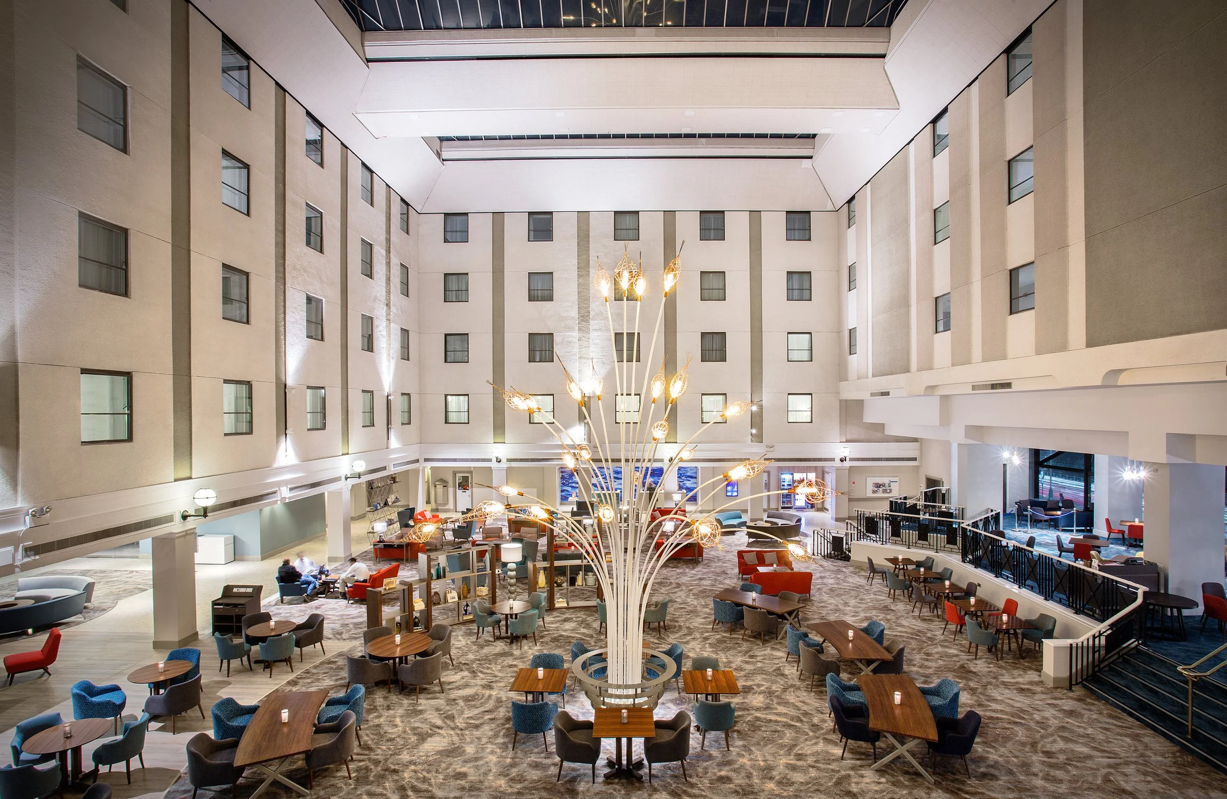 Wide angle view of atrium lounge seating at Jurys Inn hotel in Brighton