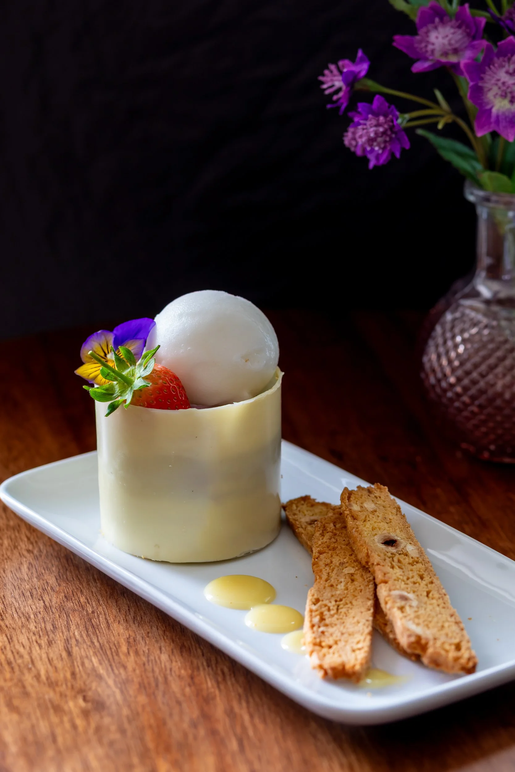 White chocolate and blueberry cheesecake with light raspberry sorbet and homemade biscotti at The Wheatsheaf Inn Grayswood, Surrey – Pub Food Photography by Sequoia Studios