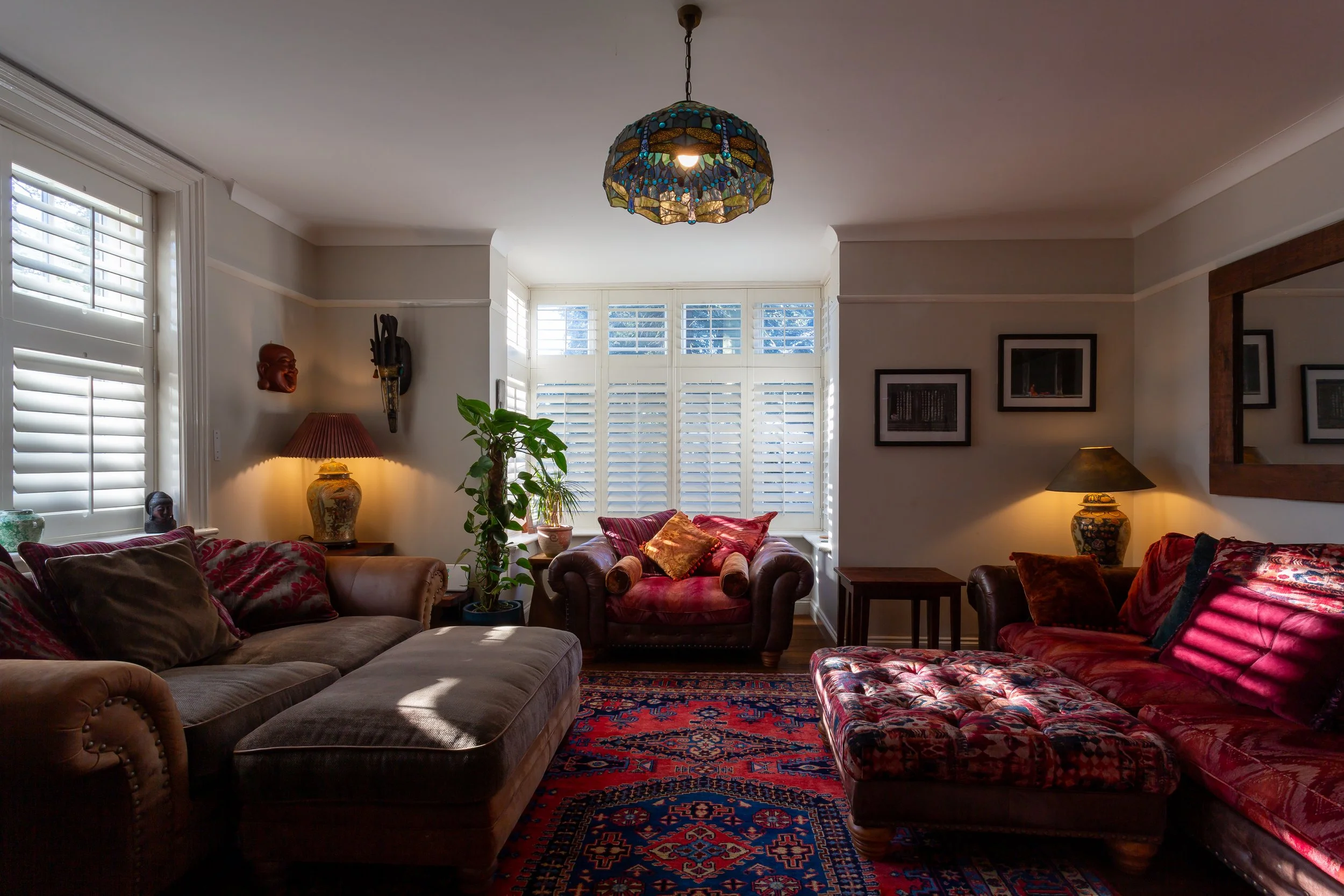 A wide angle view of large, plush living room