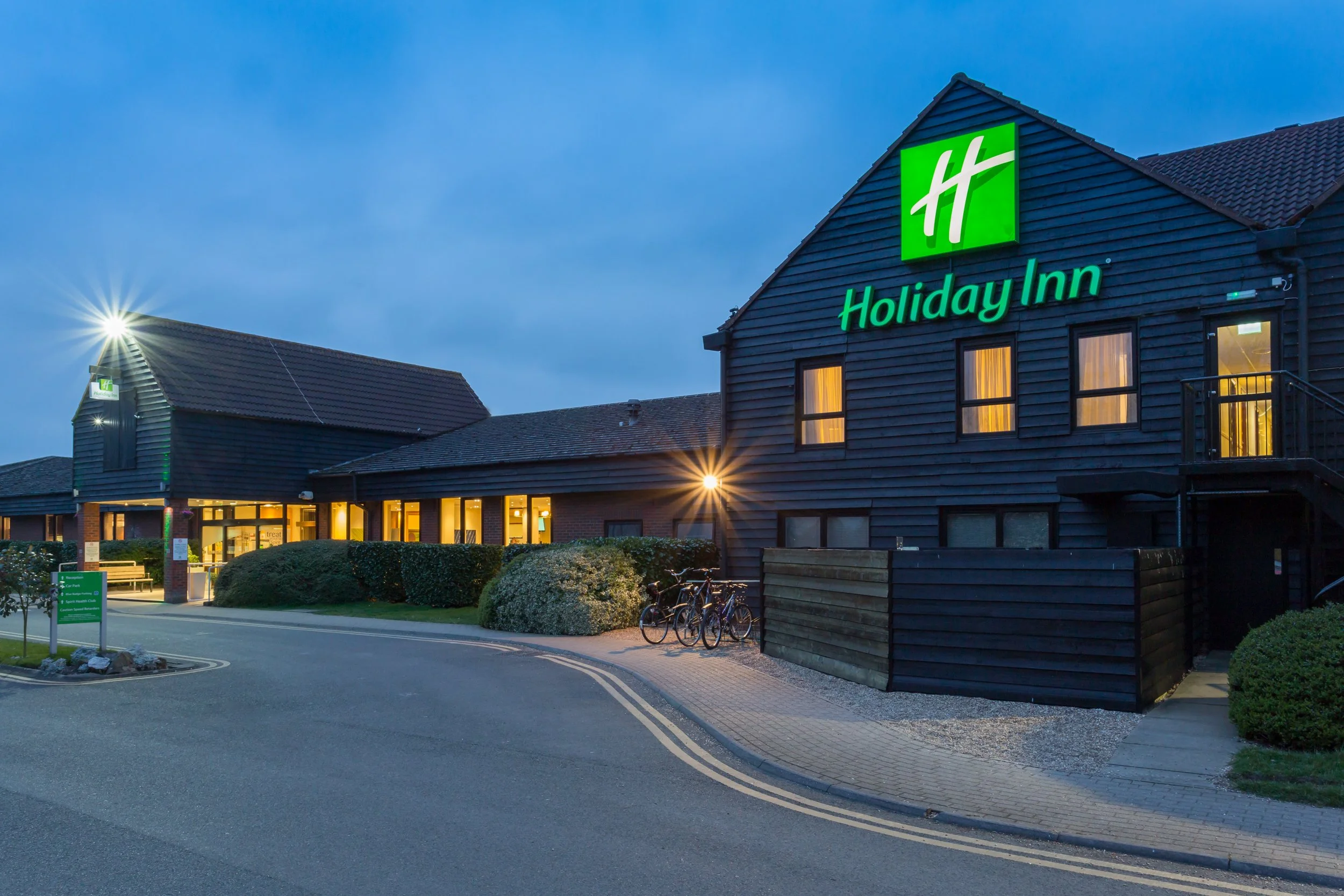 Evening exterior of Holiday Inn hotel in Cambridge