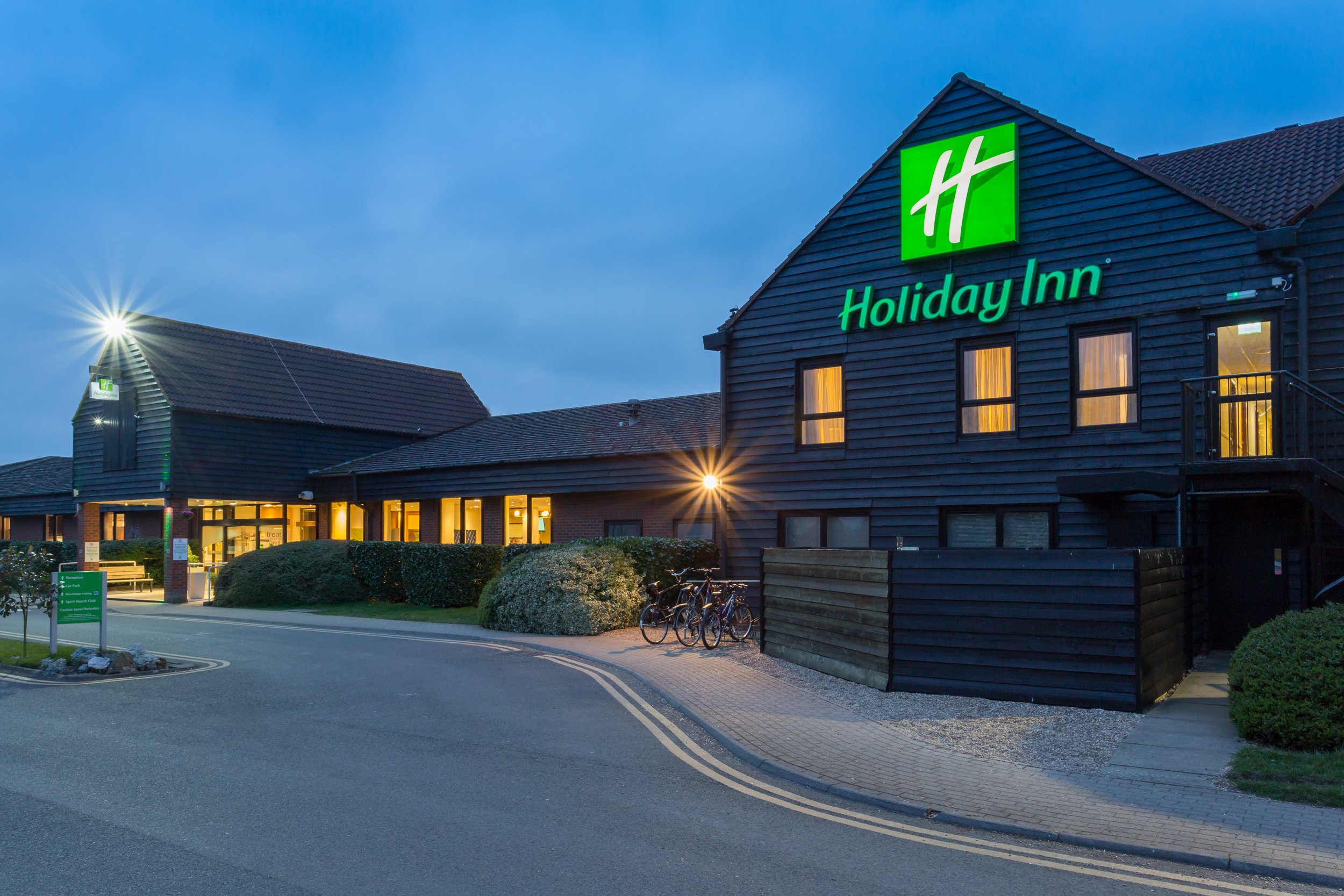 Evening exterior of Holiday Inn hotel in Cambridge