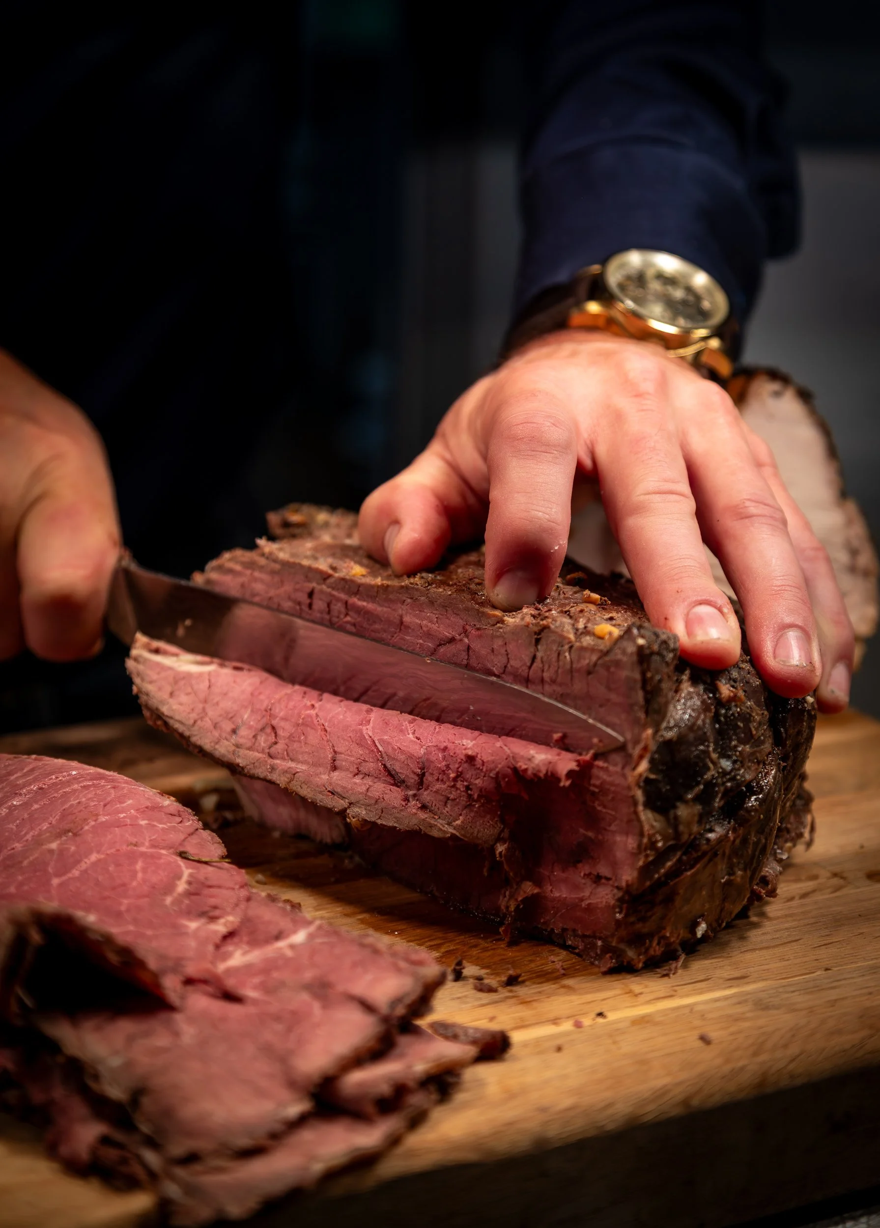 Rare roast beef being carved for The Folly Wine Bar carvery in Petersfield, Hampshire. Lifestyle photography by Sequoia Studios.