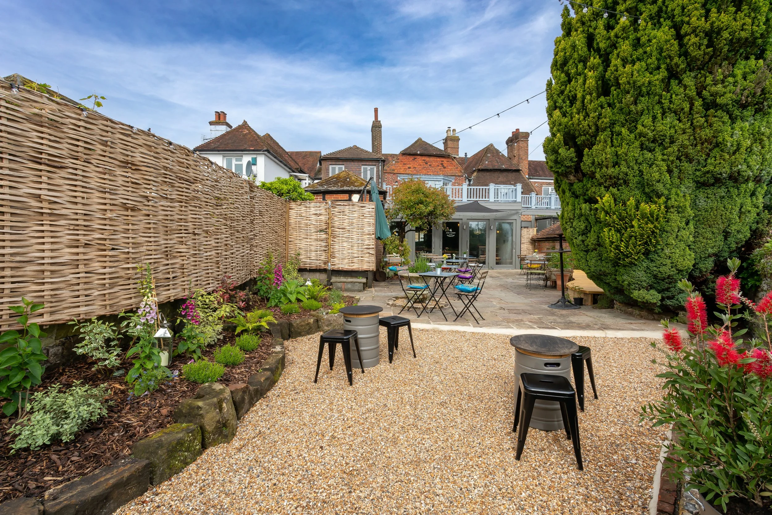 Wide angle of exterior enclosed courtyard – The Lion's Den Midhurst – Hospitality Venue Photography by Sequoia Studios