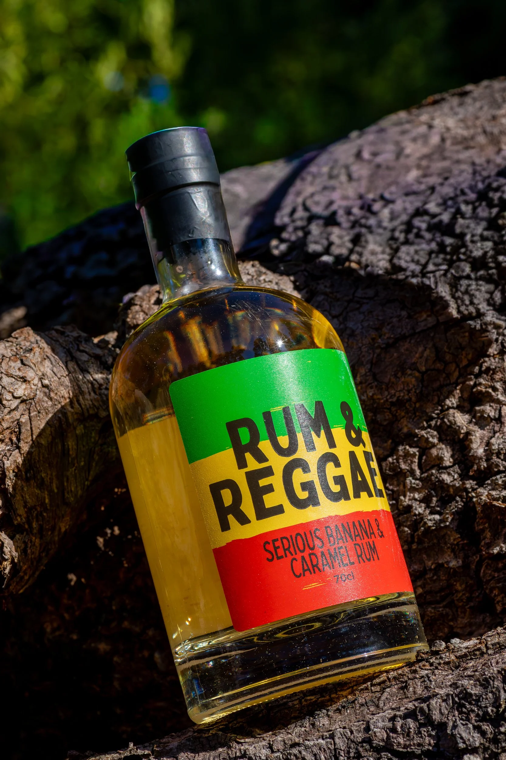 Rum &amp; Reggae Serious Banana &amp; Caramel Rum product shot on tree stump