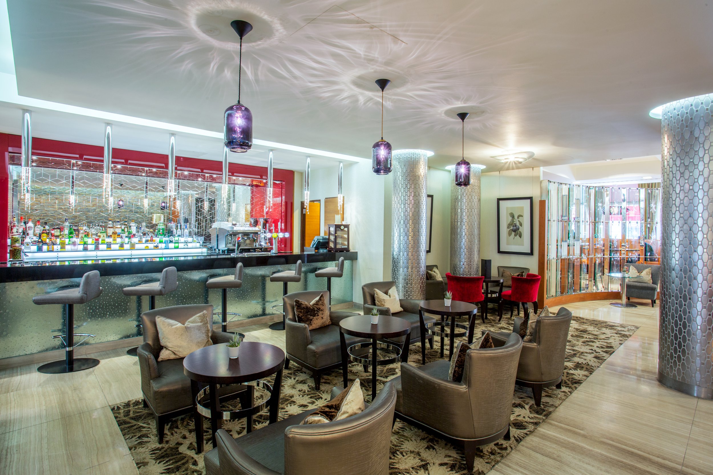 Wide shot of hotel bar and lounge area at Crowne Plaza, Kensington, London