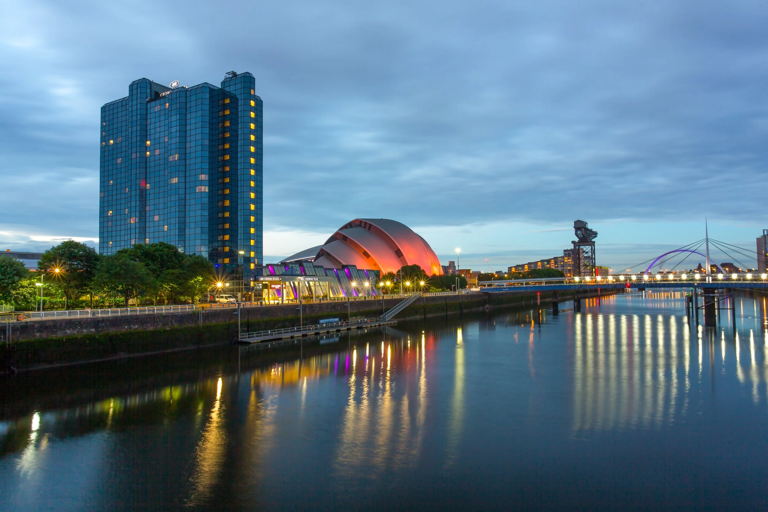 Evening exterior of Crowne Plaza hotel on the River Clyde in Glasgow, Scotland