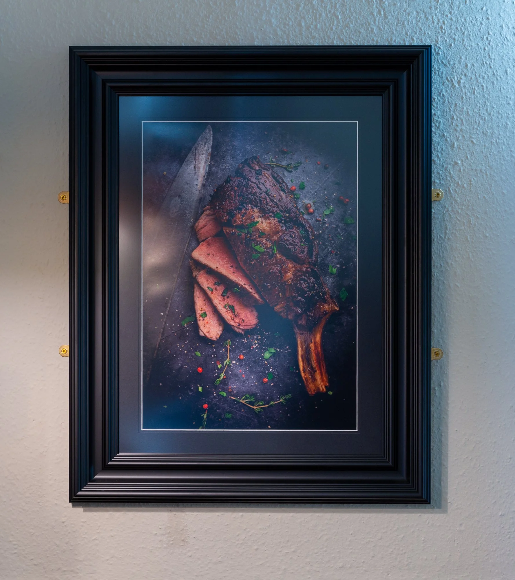 Cote du Boeuf on the wall in the dining room at The Rising Sun, Milland. F
ine art food photography by Sequoia Studios