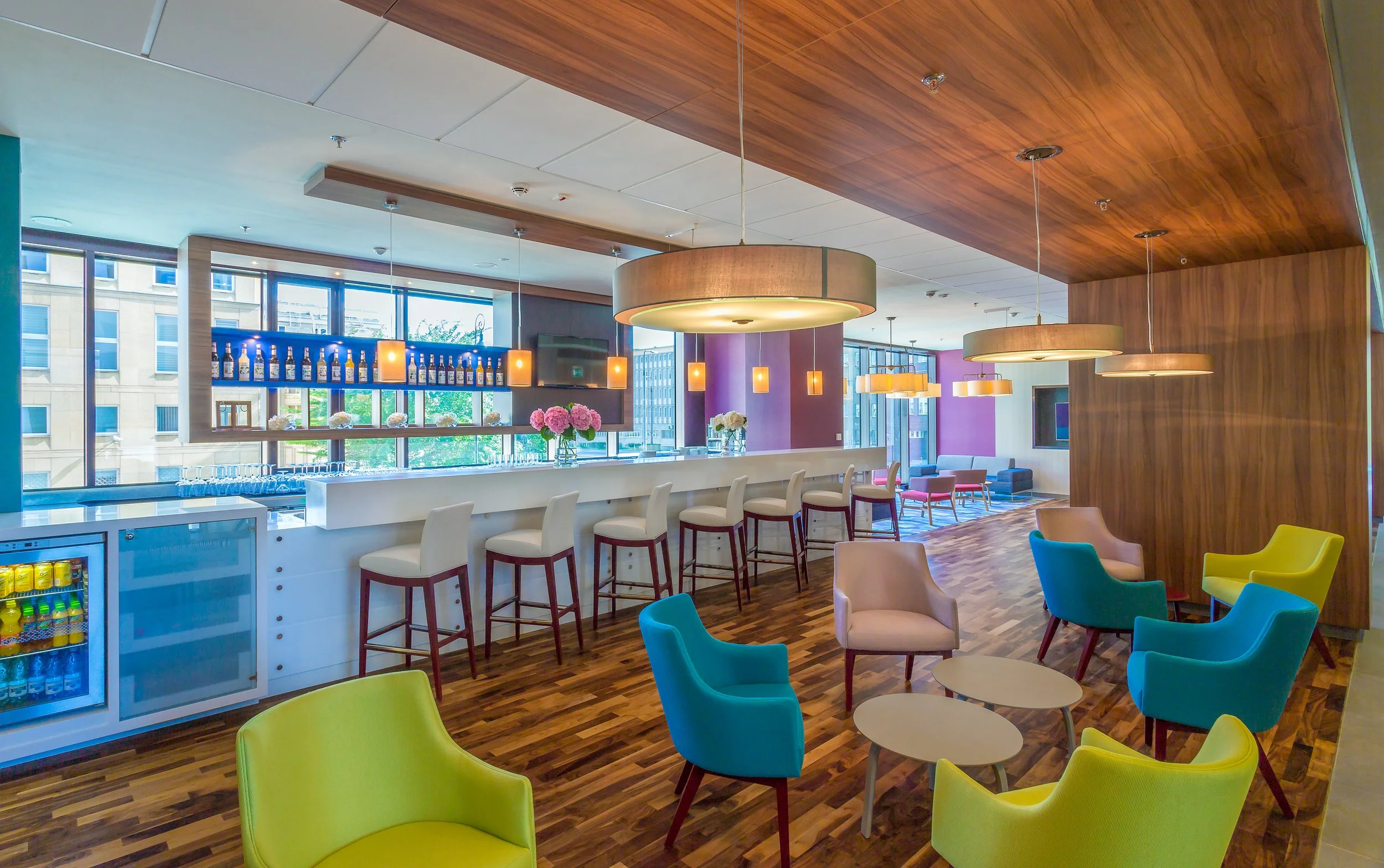 Wide daytime shot of hotel bar at Hampton by Hilton, Warsaw, Poland