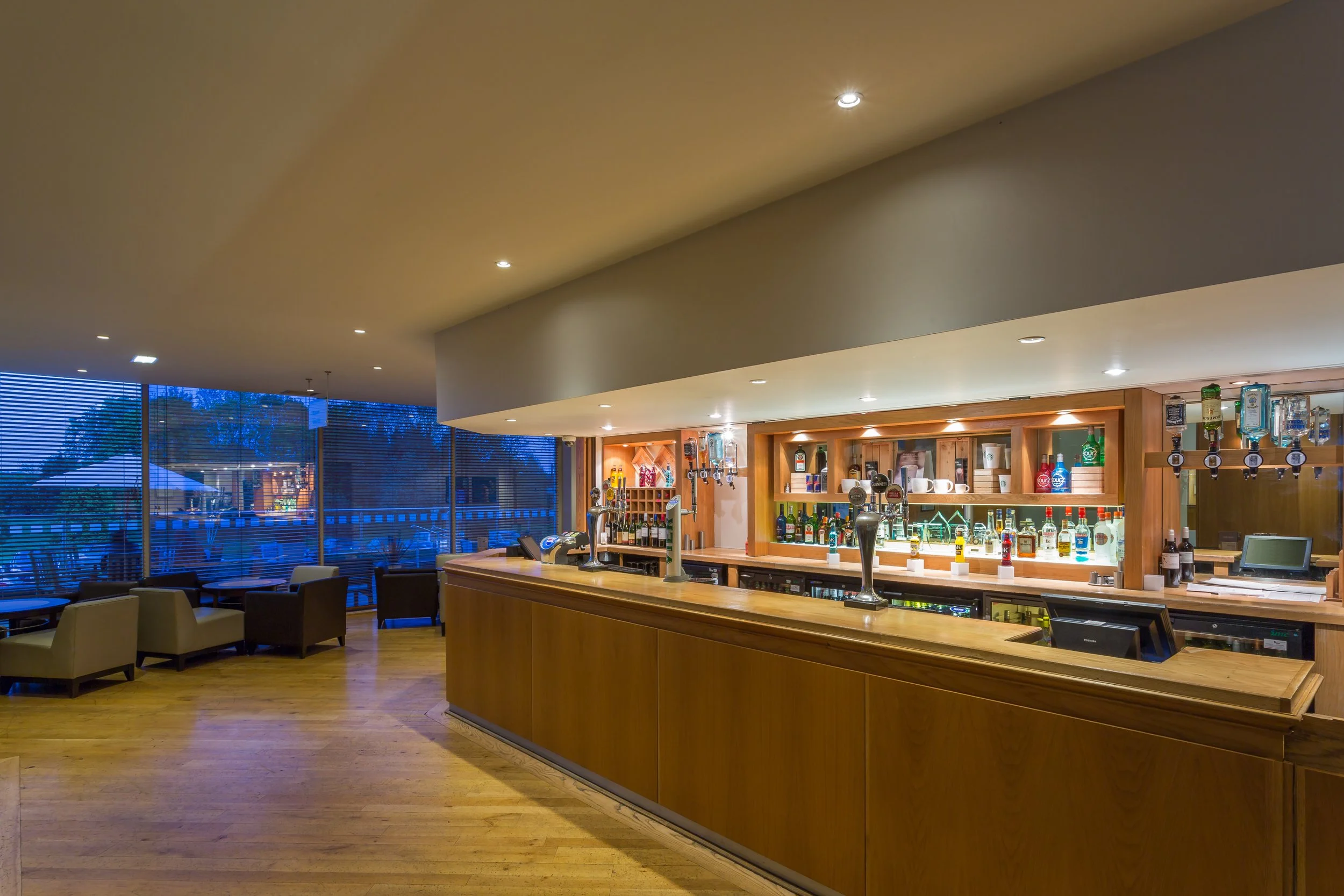 Wide evening shot of hotel bar at Holiday Inn, Rugby