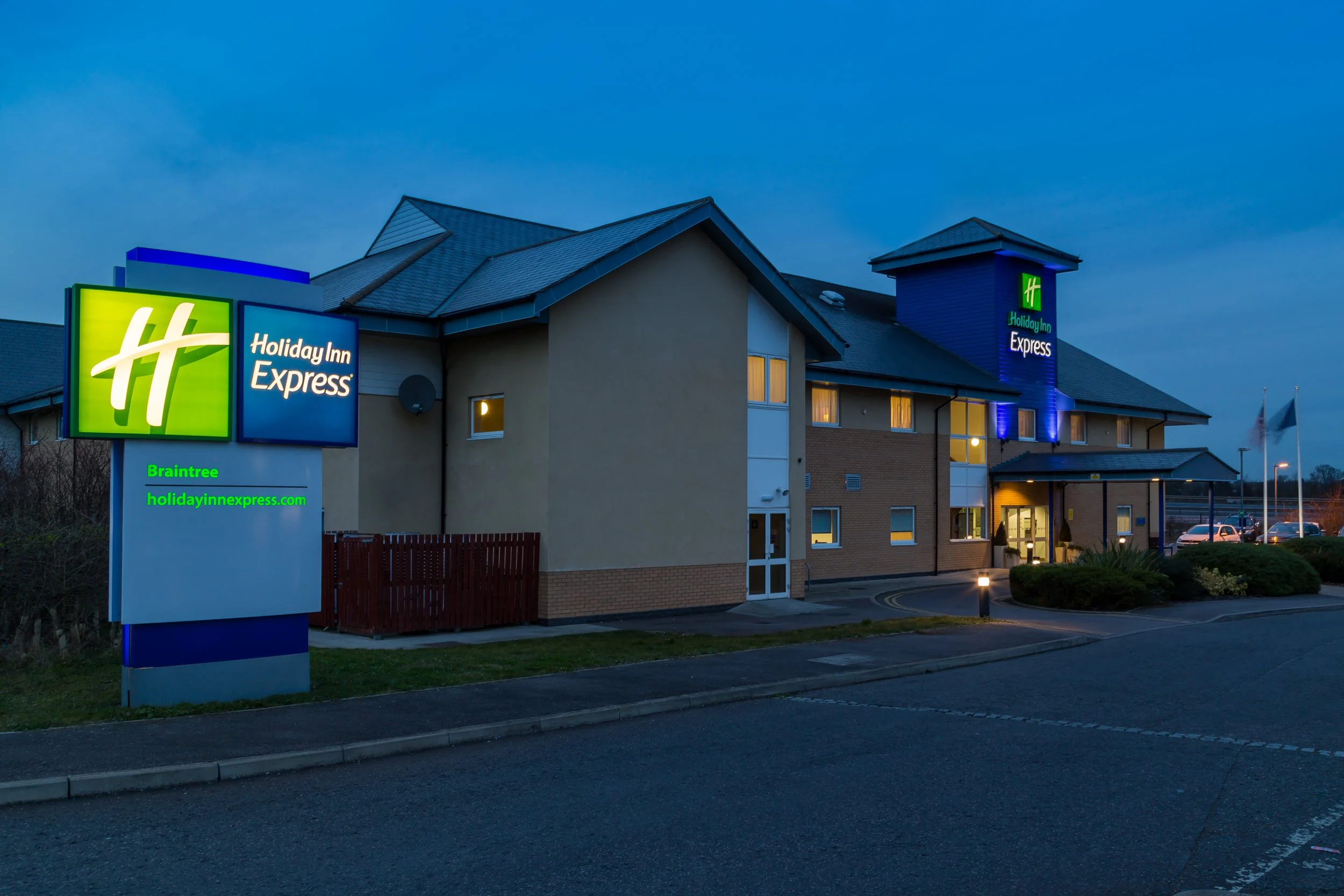 Evening exterior of Holiday Inn Express hotel in Braintree, Essex