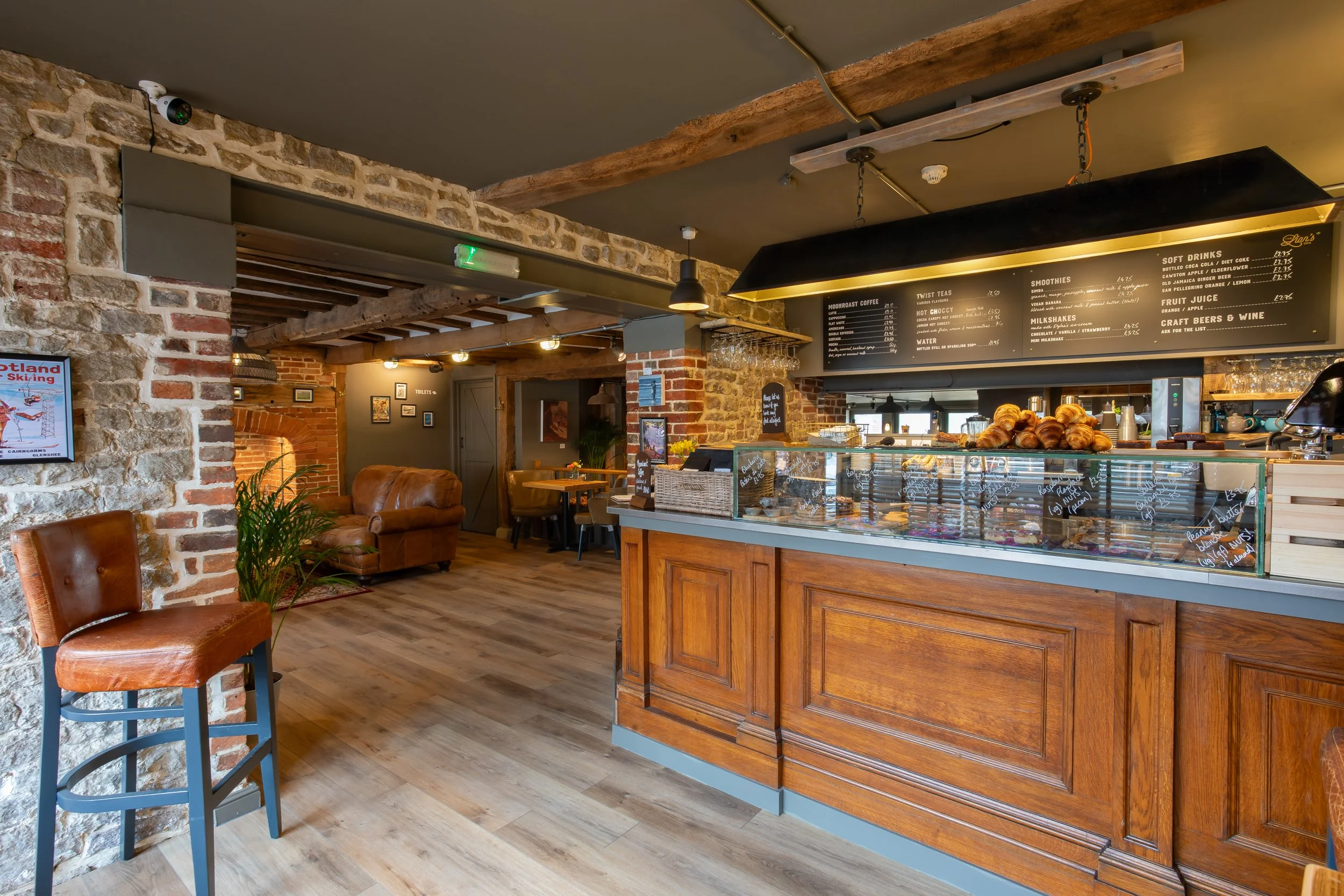 Café counter and entrance – The Lion's Den Midhurst – Hospitality Venue Photography by Sequoia Studios