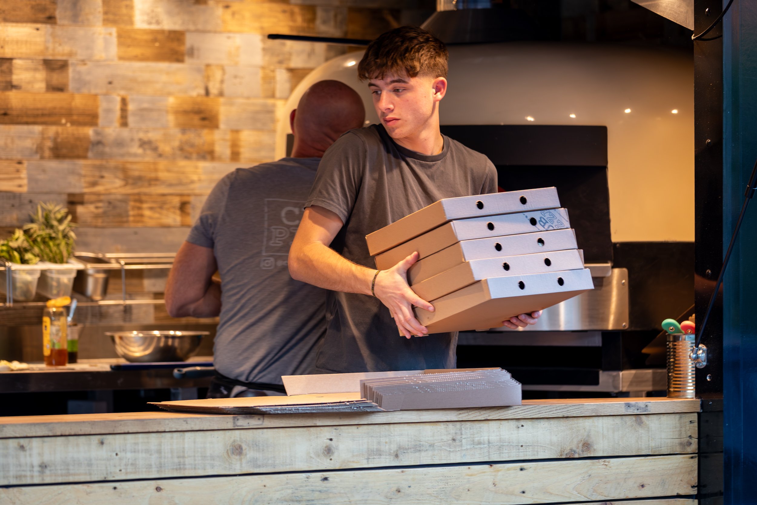 Club Pizza staff preparing for the rush at The Crossways Inn, Churt, Surrey. Food & hospitality photography by Sequoia Studios