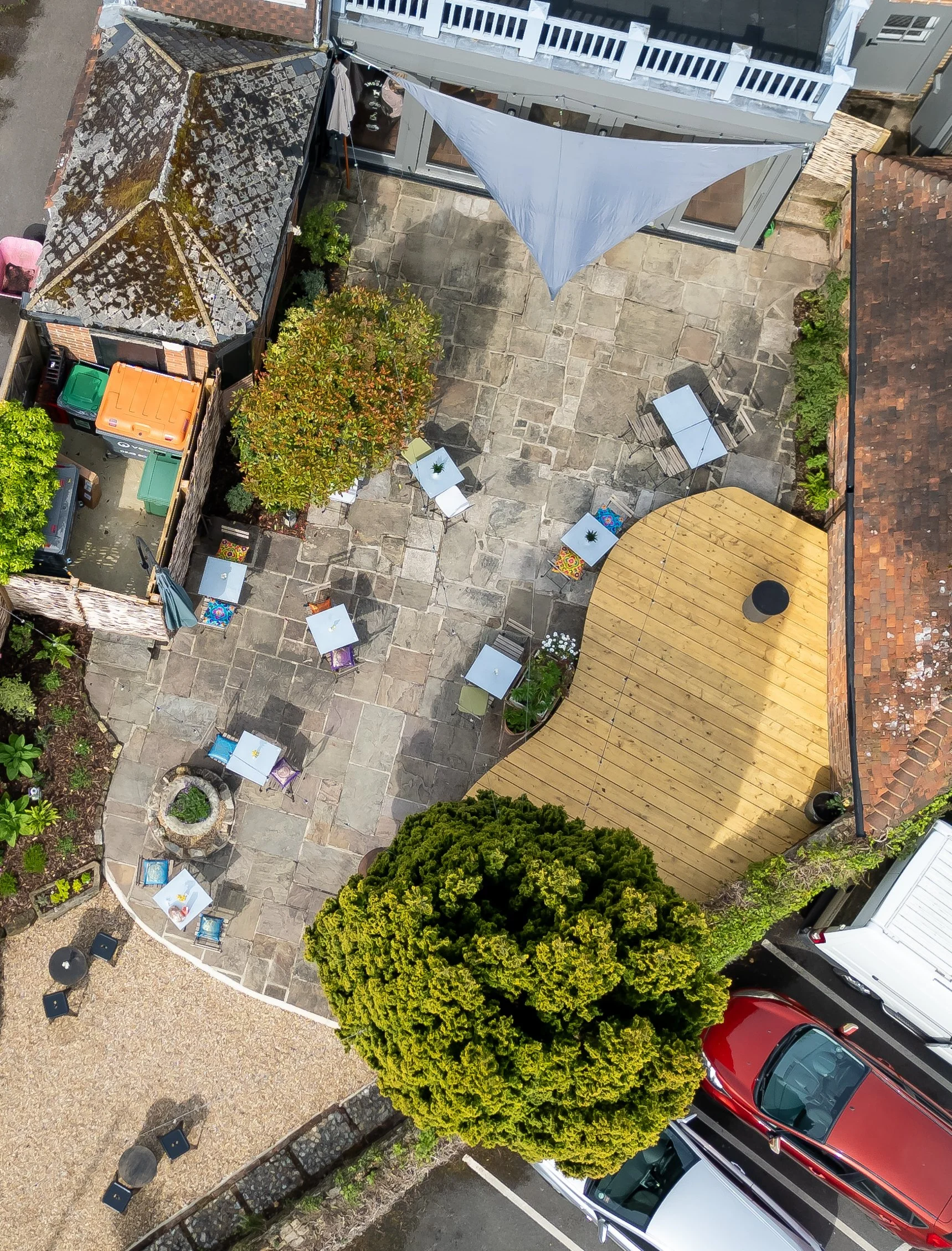 Portrait drone shot of exterior enclosed courtyard from above – The Lion's Den Midhurst – Hospitality Venue Photography by Sequoia Studios