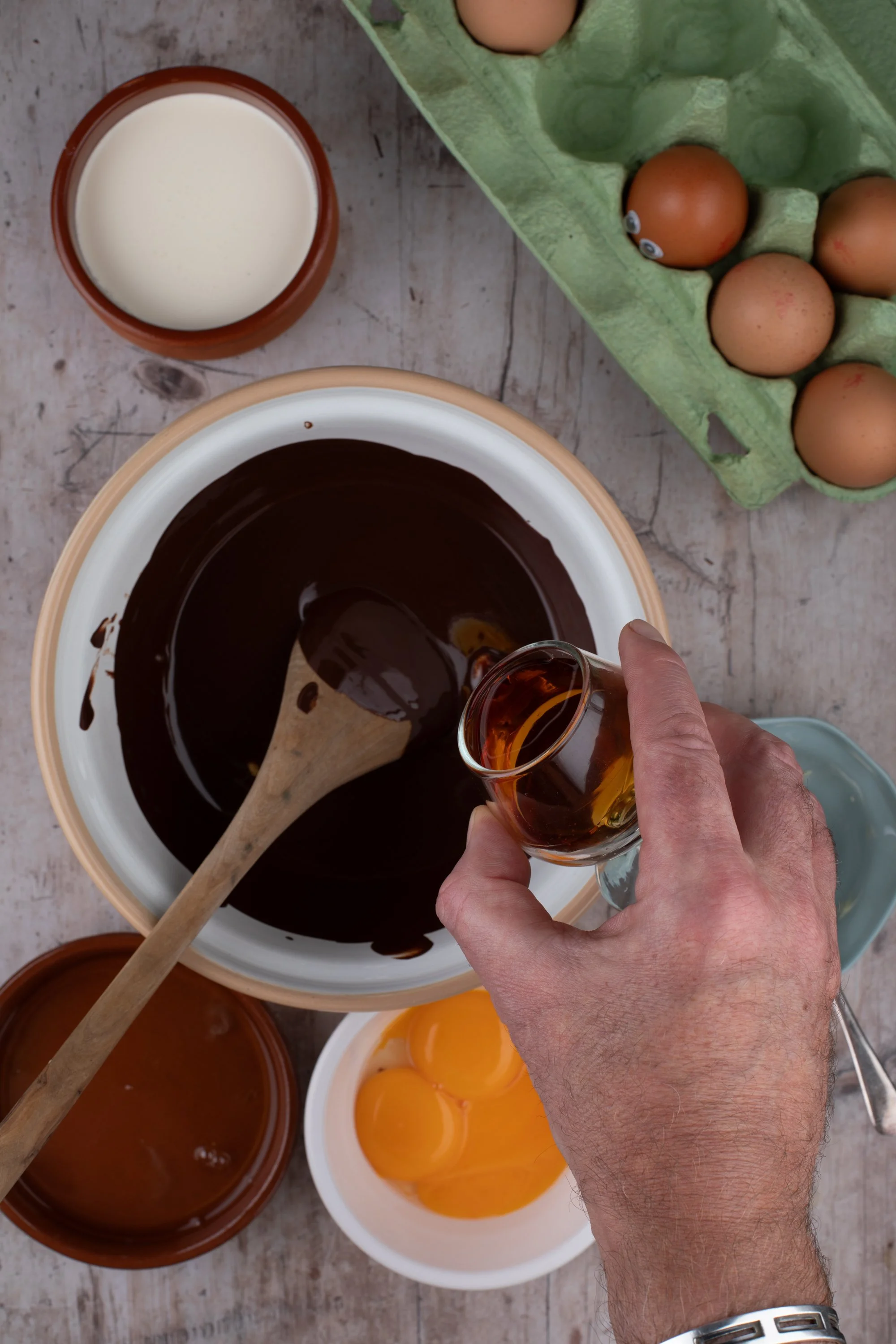 Brandy being added to indulgent chocolate mousse mixture