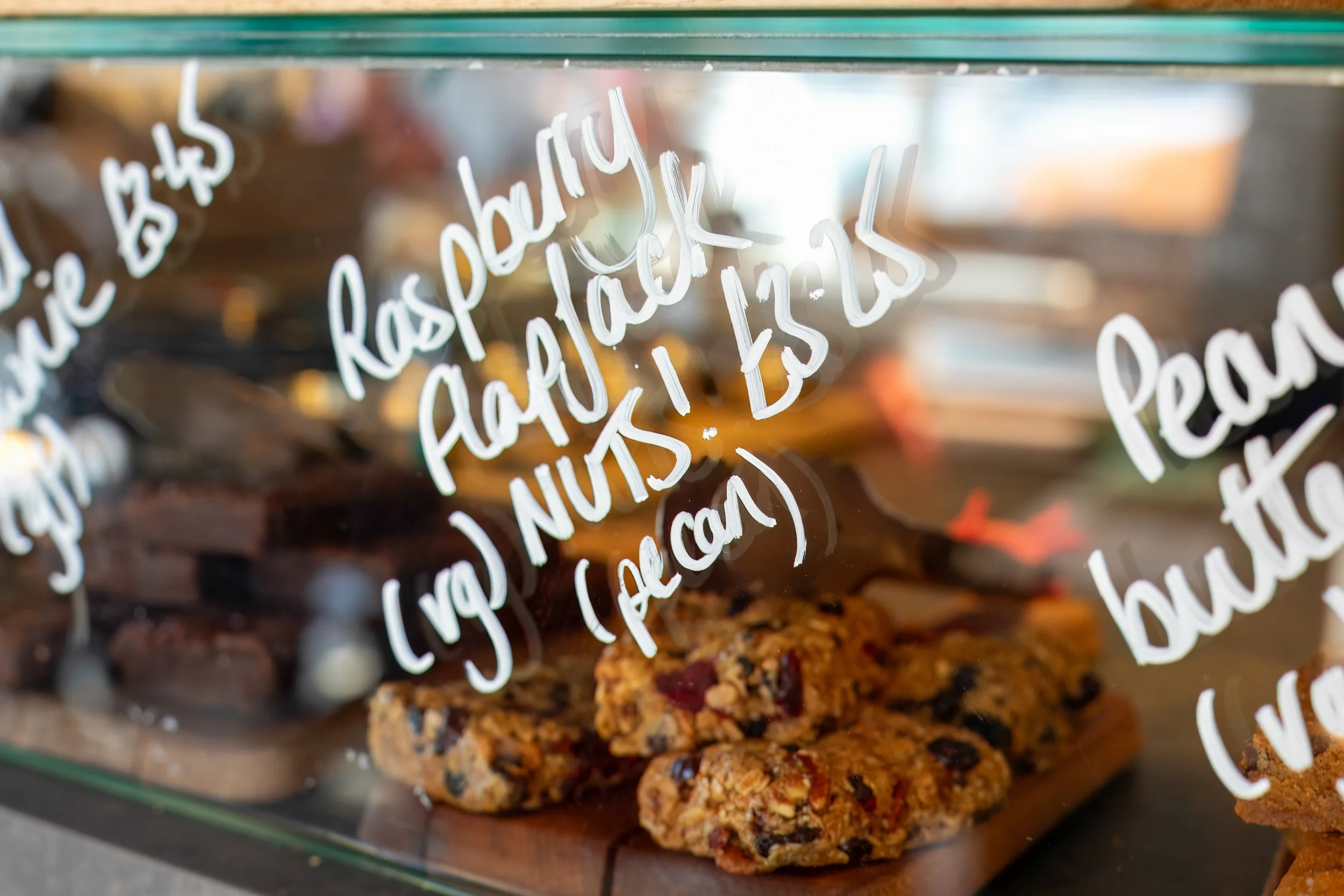 Raspberry flapjacks for sale at the counter – The Lion's Den Café, Haslemere, Surrey – Food Photography by Sequoia Studios