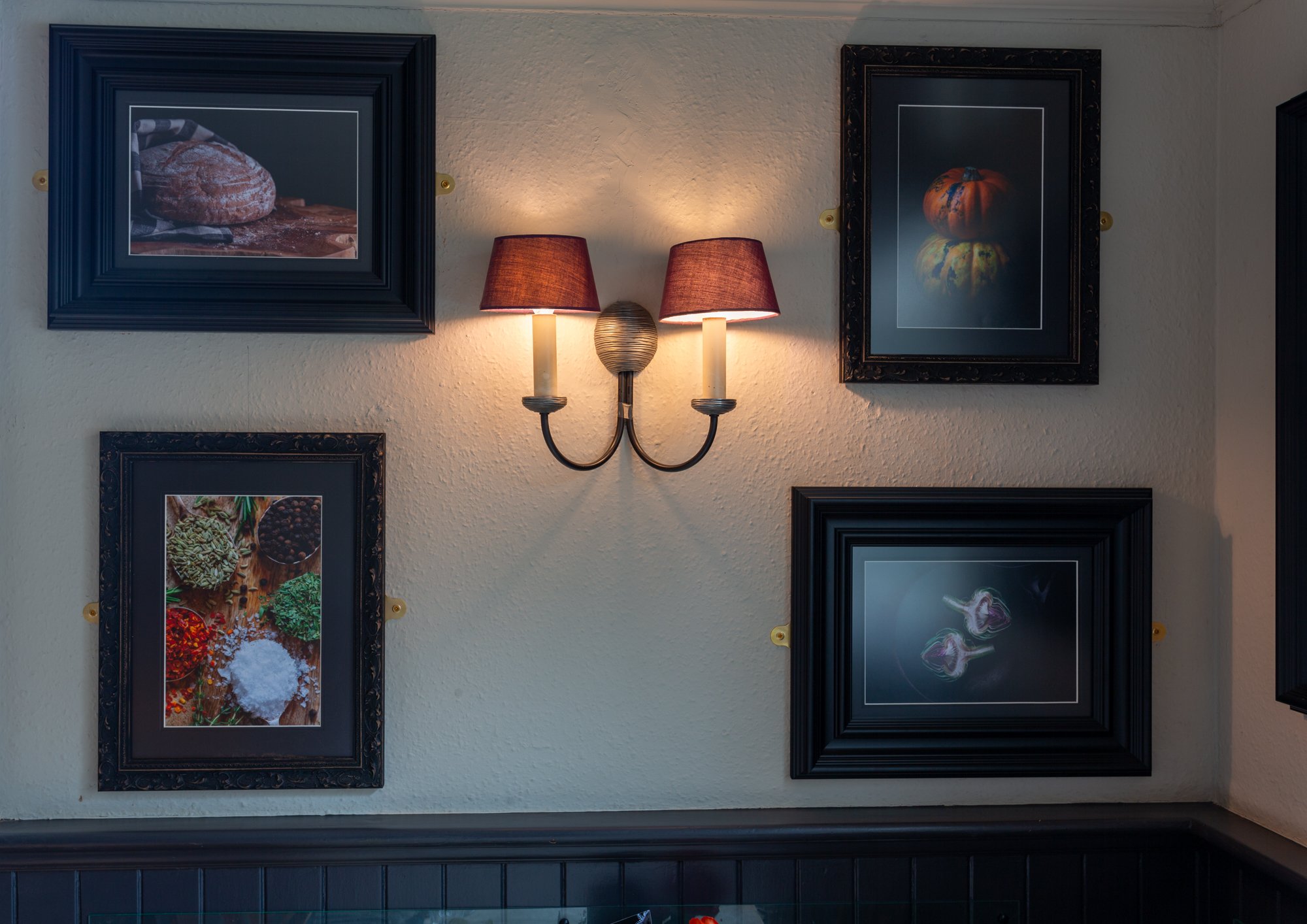 One wall of the dining room at The Rising Sun, Milland with fine art food photography by Sequoia Studios