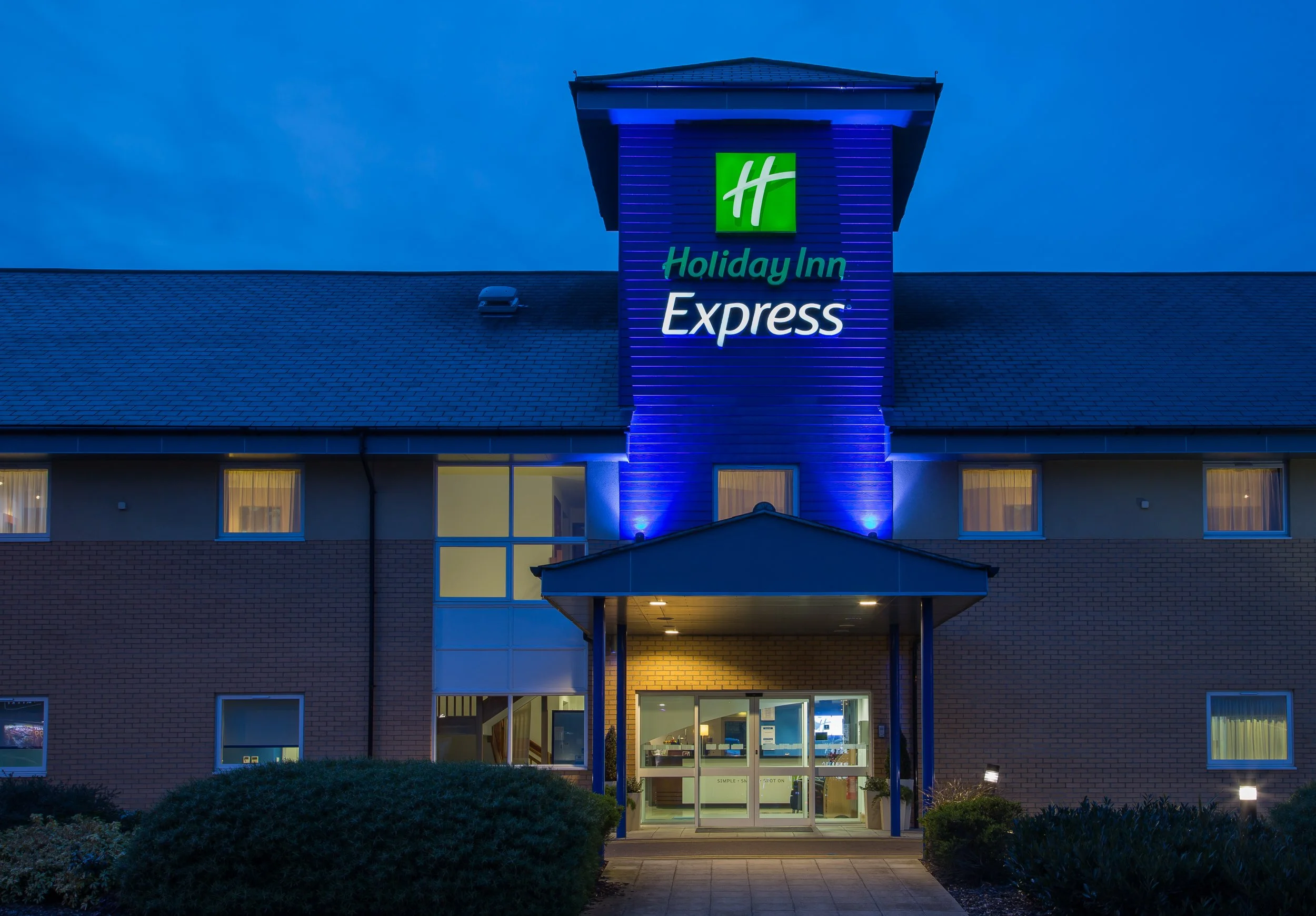 Evening exterior of Holiday Inn Express hotel in Braintree, Essex