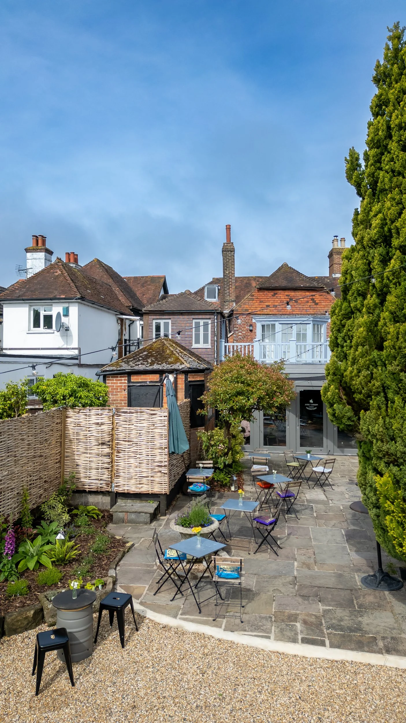 Portrait drone shot of exterior enclosed courtyard – The Lion's Den Midhurst – Hospitality Venue Photography by Sequoia Studios