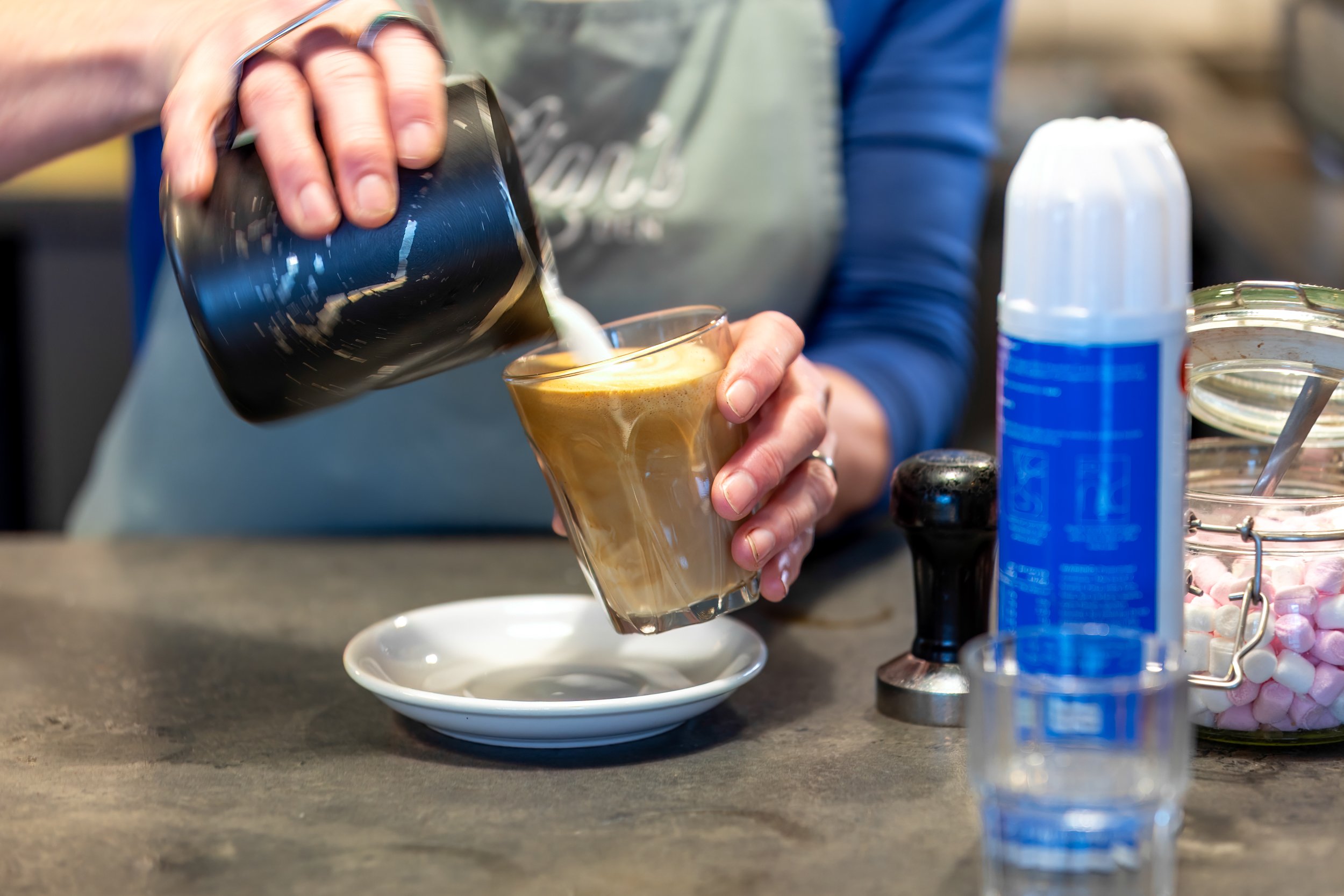 Latte coffee being poured  – The Lion's Den Café, Haslemere, Surrey – Drink Photography by Sequoia Studios