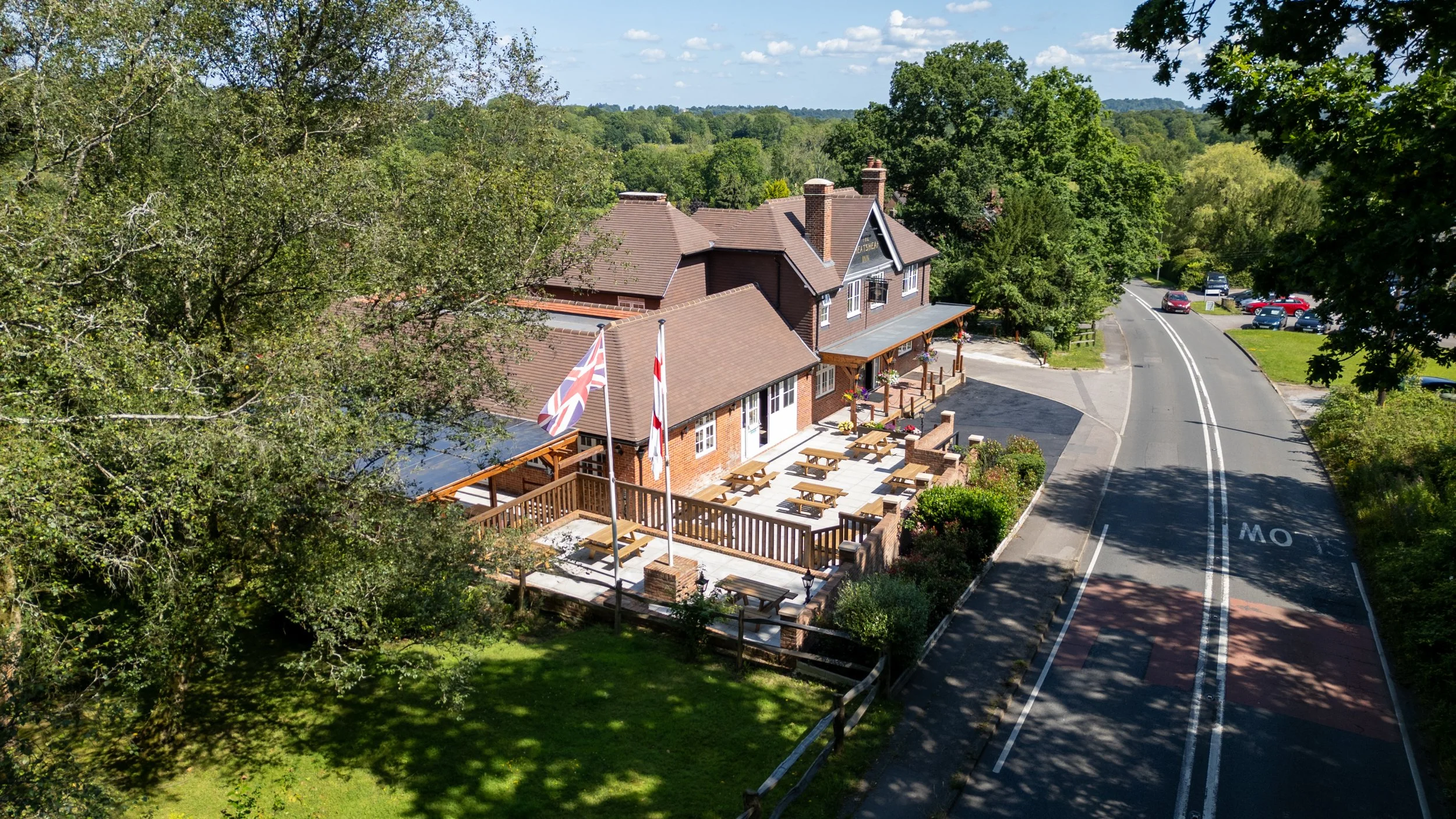 Daytime exterior drone shot of The Wheatsheaf Inn in Grayswood near Haslemere, Surrey