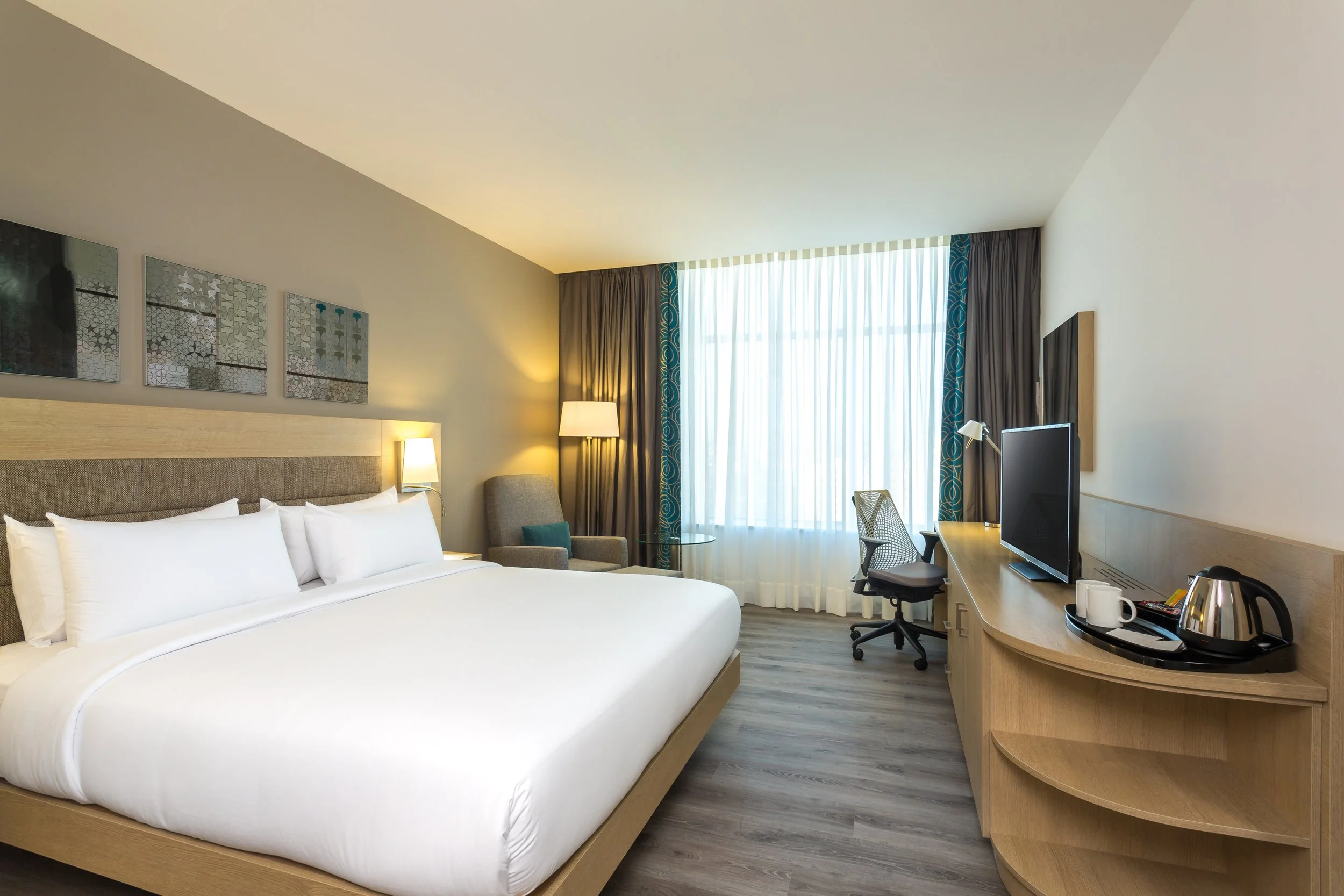 guest-room-king-bed-sea-view-sheers-closed-hilton-garden-inn-tangier-morocco.jpg