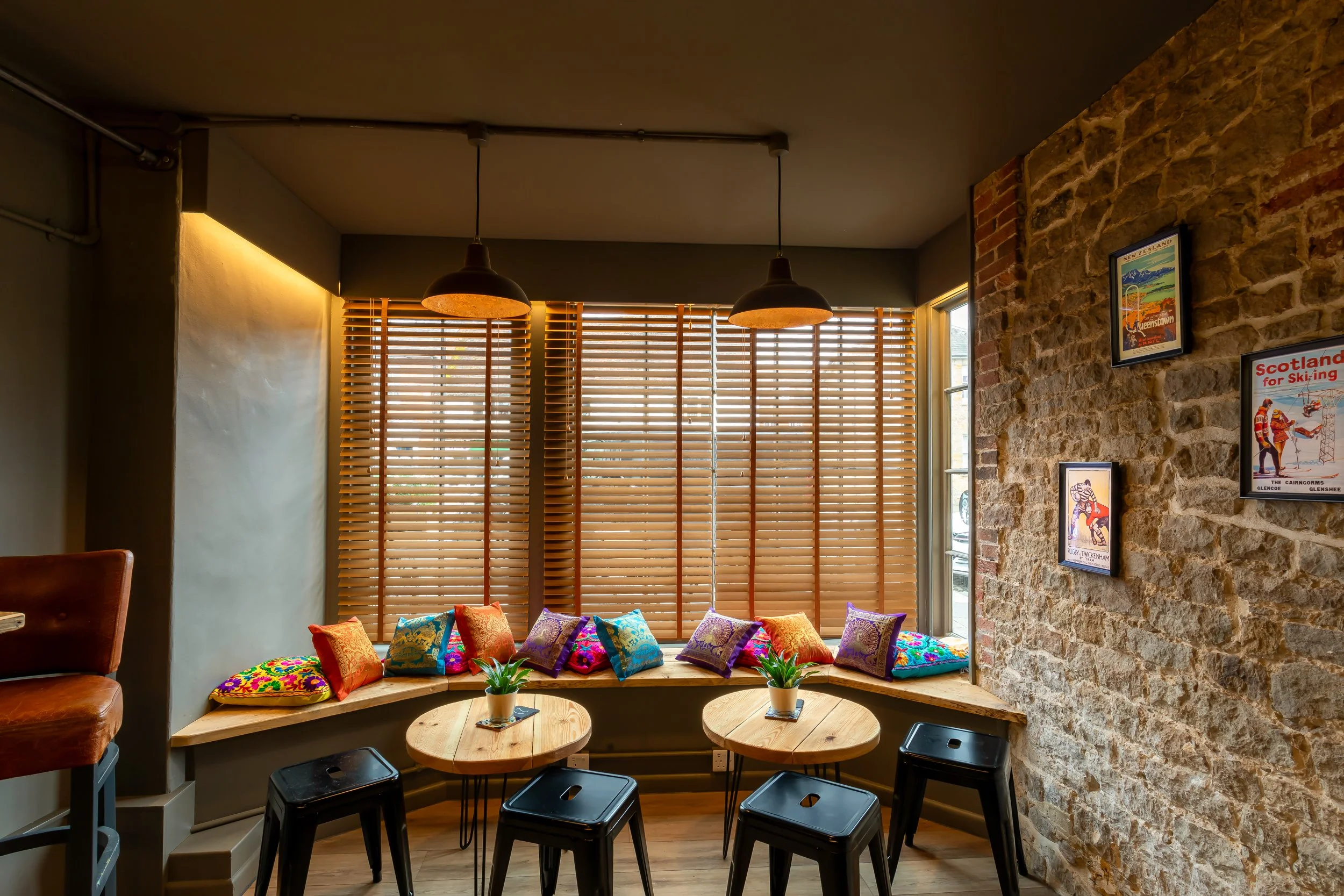Tight shot of small tables in bay window – The Lion's Den Midhurst – Hospitality Venue Photography by Sequoia Studios