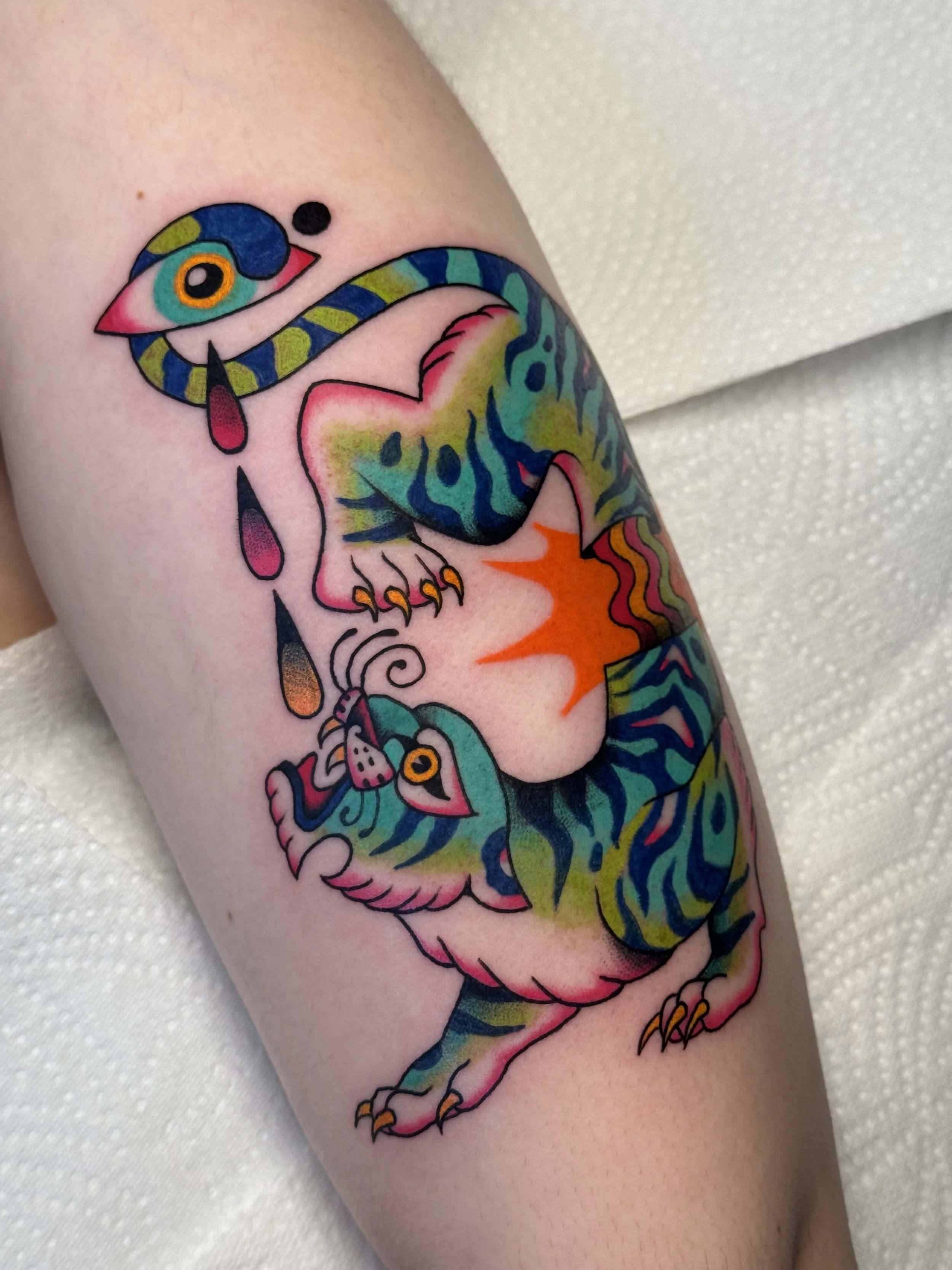 Colorful tattoo of a psychedelic tiger with vibrant patterns, featuring cartoonish style with bold lines and bright colours.