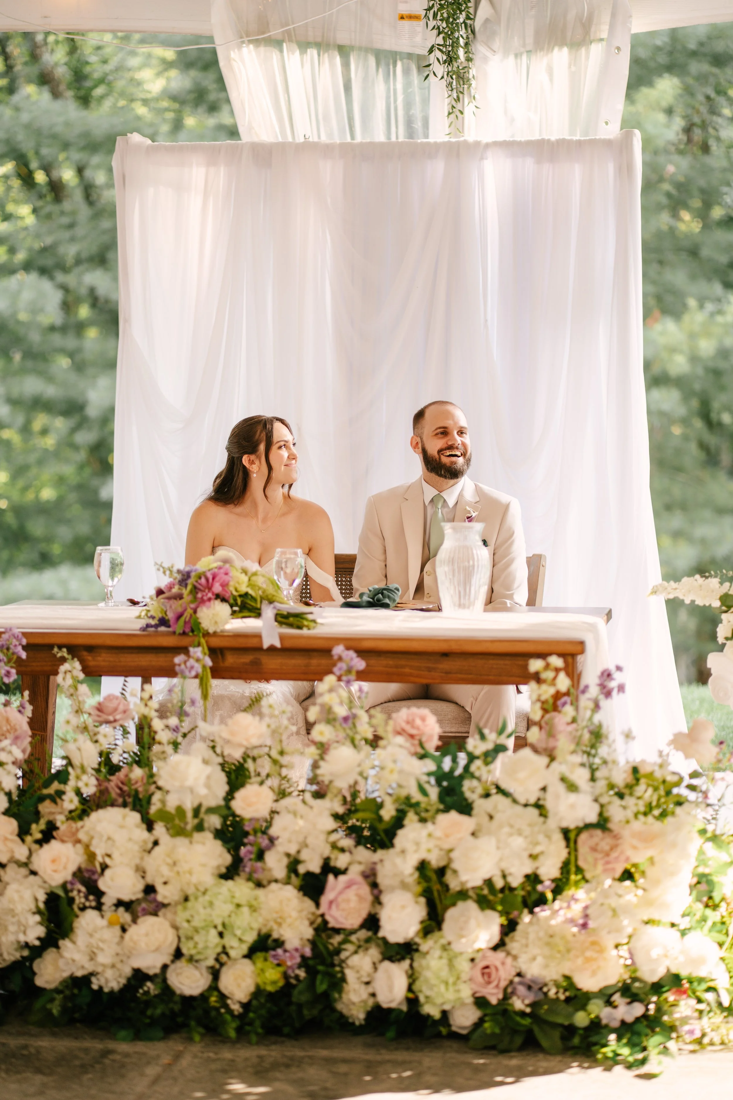 Beautiful Full Floral Meadow built custom for the Couple , in ivory , cream and purple accents . Our Floral Meadow can be transitioned from Ceremony to Reception Photo : Fabus Photo & Film 
Venue : Trillium Woods 
Coordinator/ Planner : S.R Event Des