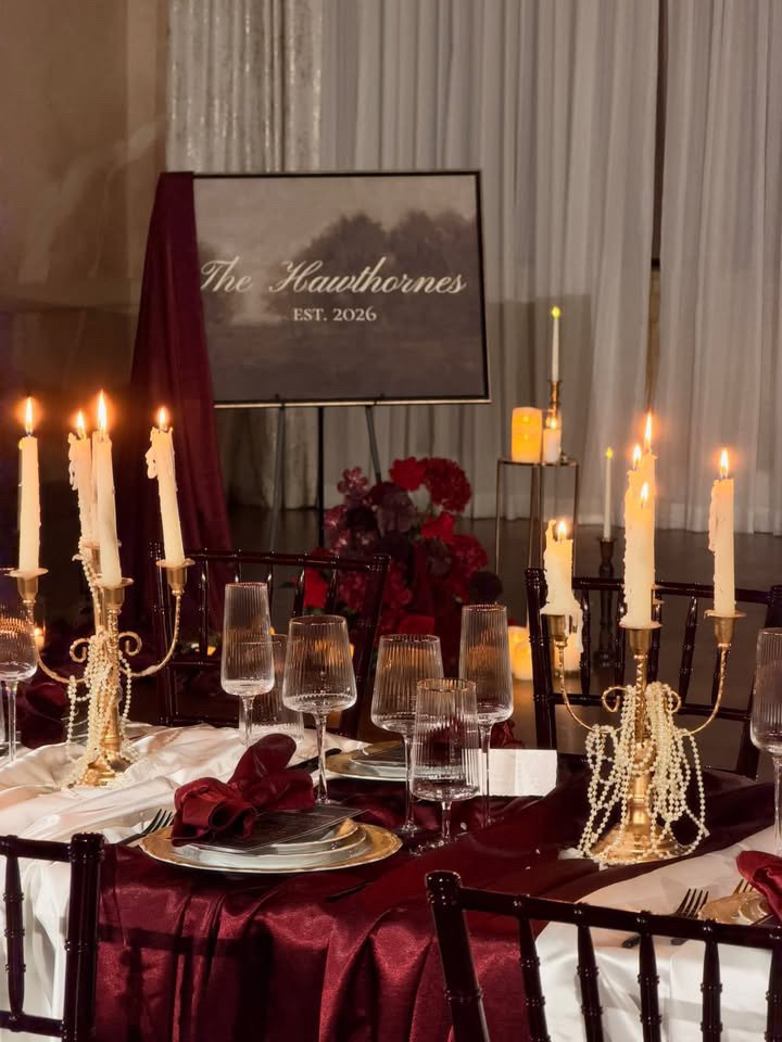 A dramatic floral installation featuring deep red roses, burgundy blooms, cascading amaranthus, and layered candlelight. Designed by S.R. Event Design & Decor for a dark romance styled shoot at Bella Sera Event Villa near Pittsburgh, this statement a