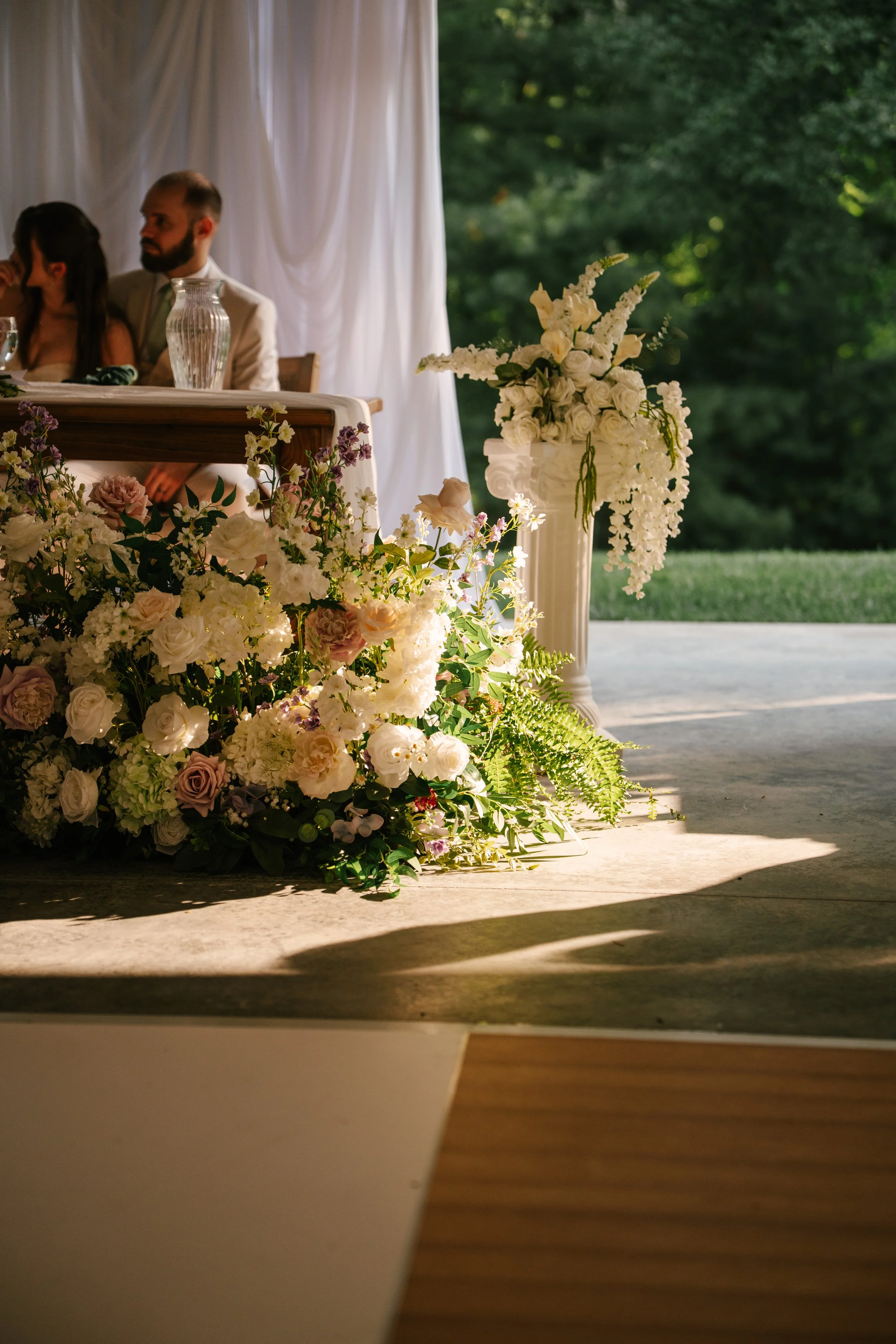 Beautiful Full Floral Meadow built custom for the Couple , in ivory , cream and purple accents . Our Floral Meadow can be transitioned from Ceremony to Reception Photo : Fabus Photo & Film 
Venue : Trillium Woods 
Coordinator/ Planner : S.R Event Des