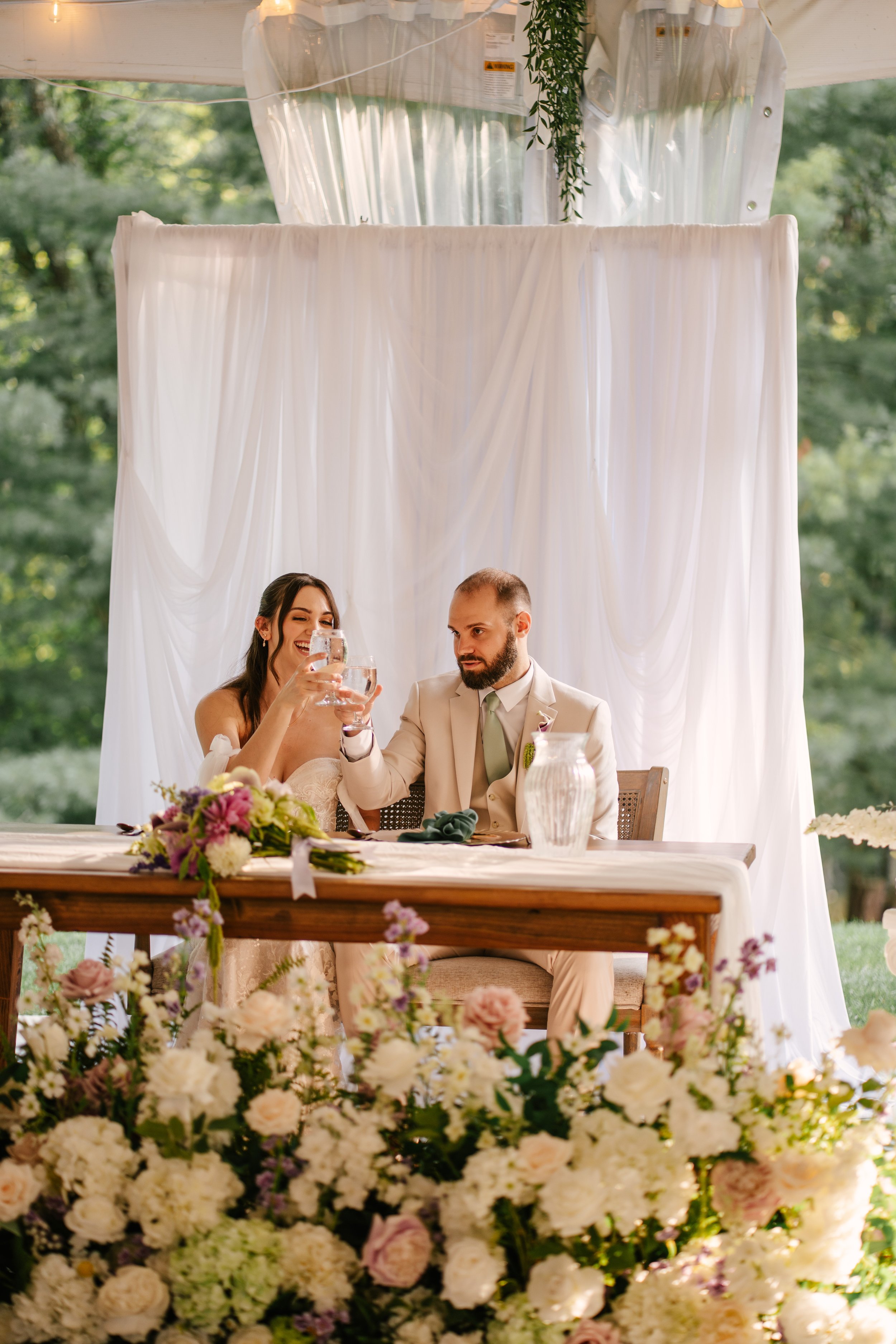 Beautiful Full Floral Meadow built custom for the Couple , in ivory , cream and purple accents . Our Floral Meadow can be transitioned from Ceremony to Reception Photo : Fabus Photo & Film 
Venue : Trillium Woods 
Coordinator/ Planner : S.R Event Des