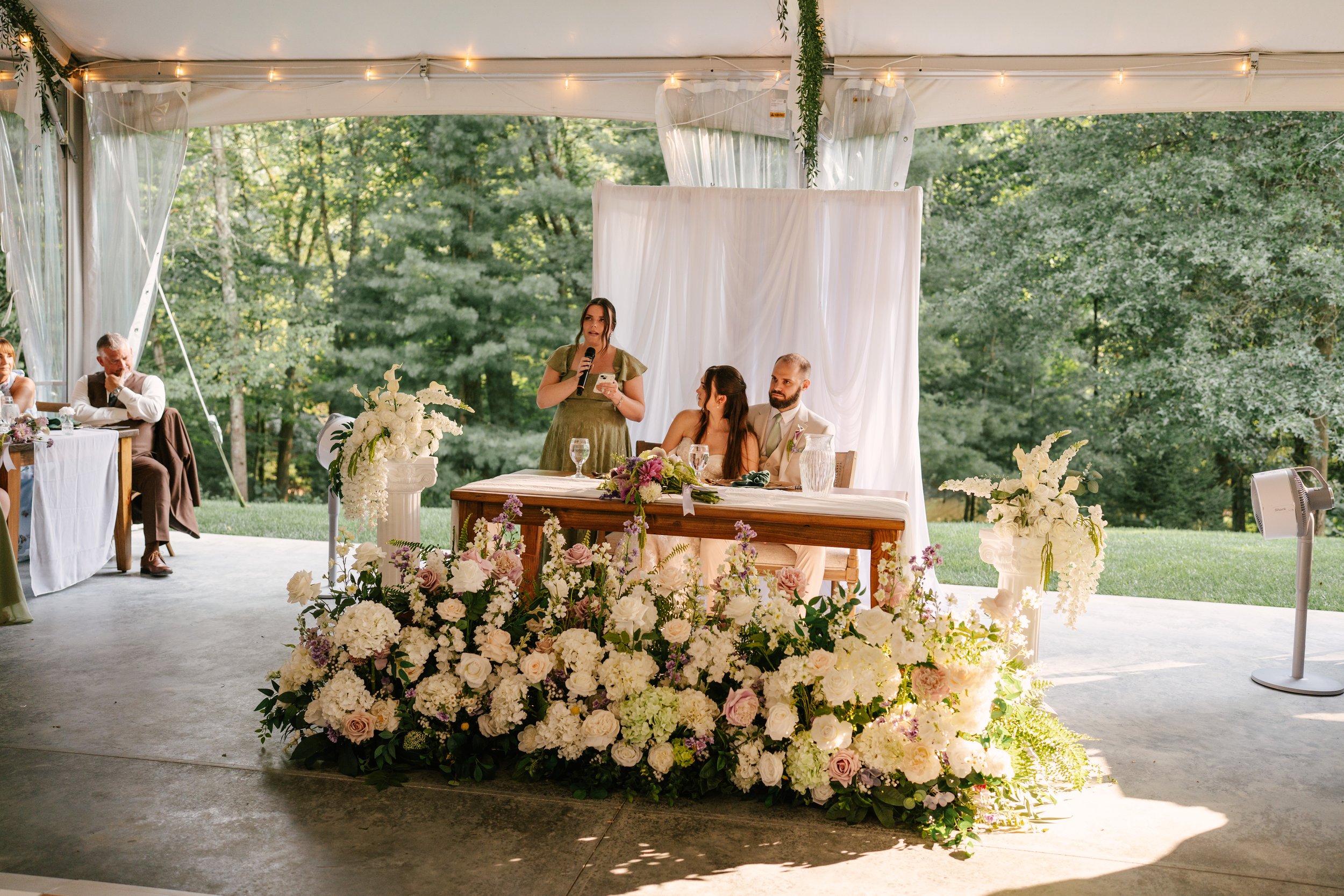 Beautiful Full Floral Meadow built custom for the Couple , in ivory , cream and purple accents . Our Floral Meadow can be transitioned from Ceremony to Reception Photo : Fabus Photo & Film 
Venue : Trillium Woods 
Coordinator/ Planner : S.R Event Des