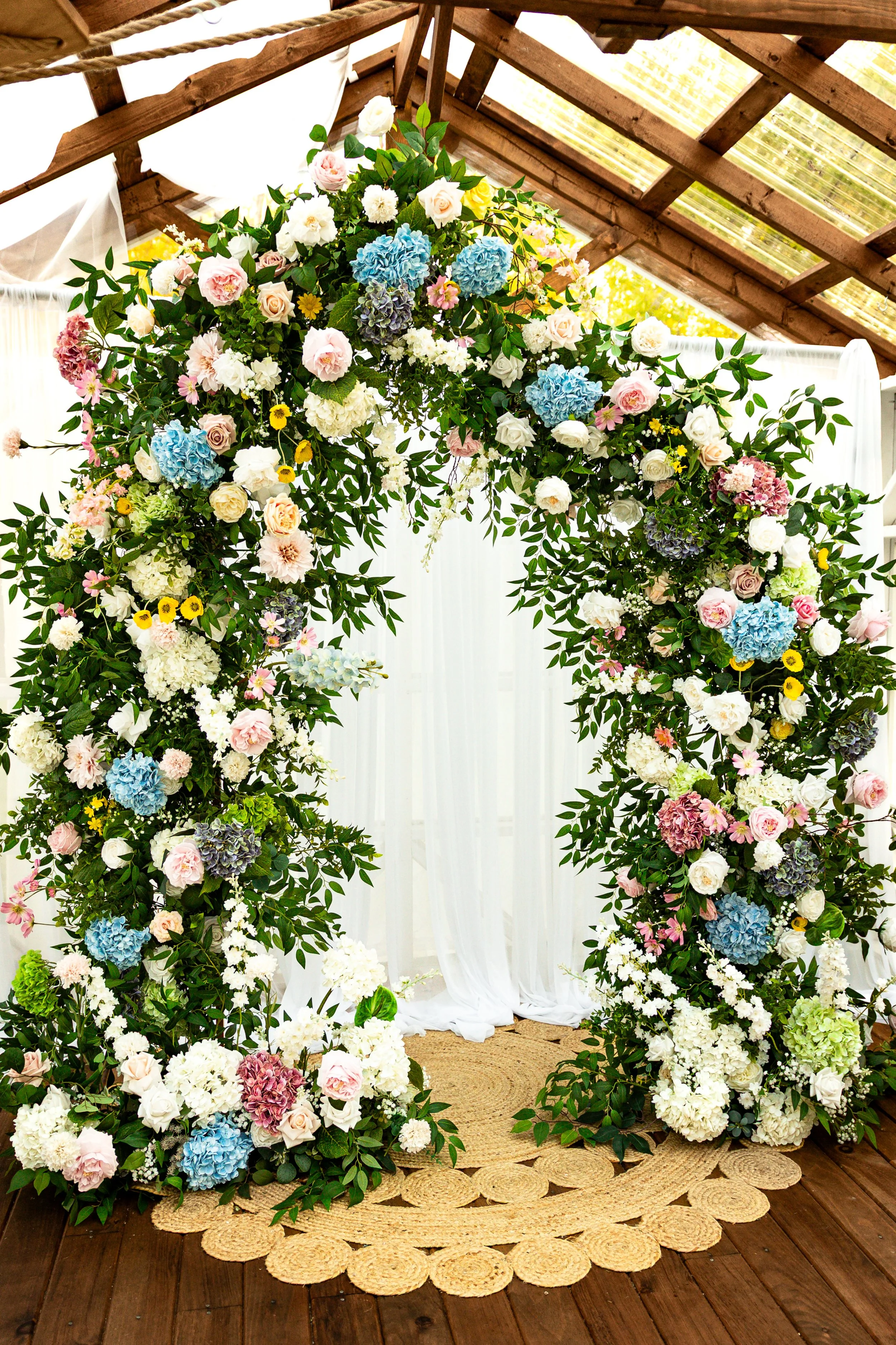 Customized Wild Flower floral arch hand crafted from real touch flowers