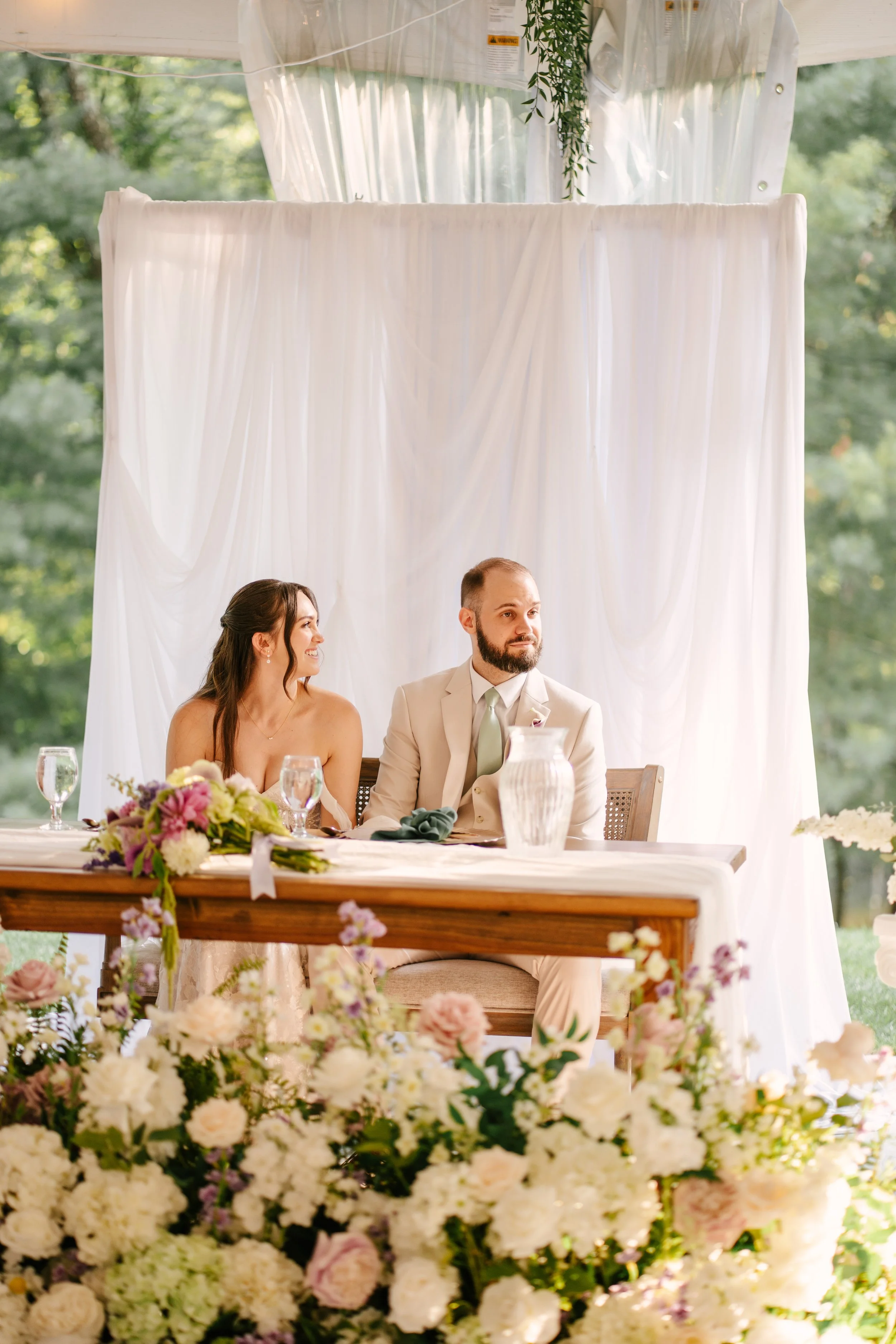 Beautiful Full Floral Meadow built custom for the Couple , in ivory , cream and purple accents . Our Floral Meadow can be transitioned from Ceremony to Reception Photo : Fabus Photo & Film 
Venue : Trillium Woods 
Coordinator/ Planner : S.R Event Des