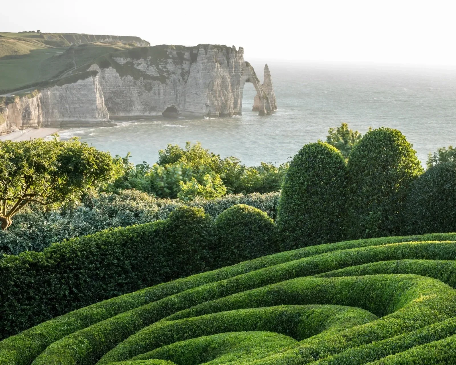 Scenic gardens with the white cliffs of the Normandy coastline in the background