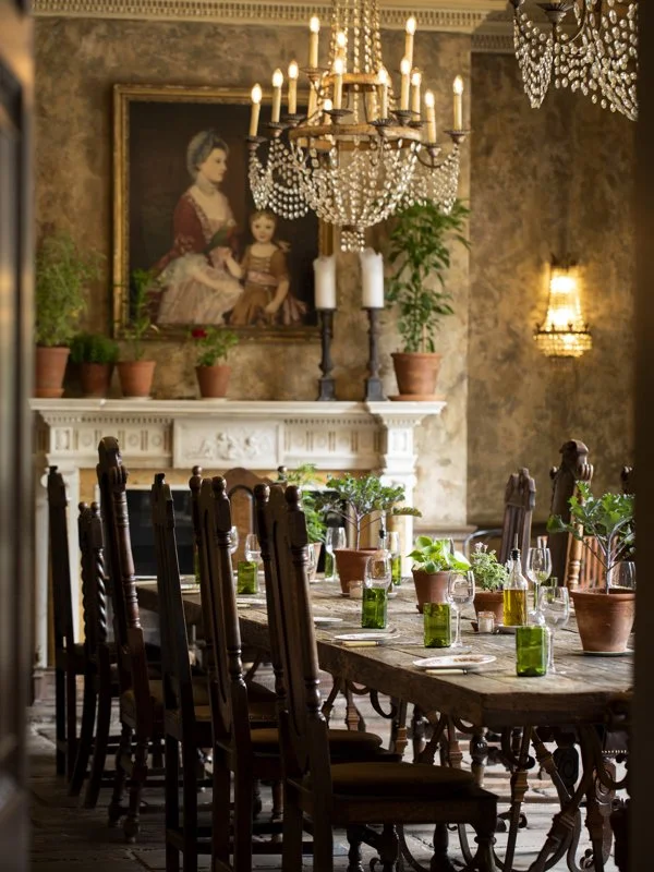 Warmly lit dining table in a historic English house