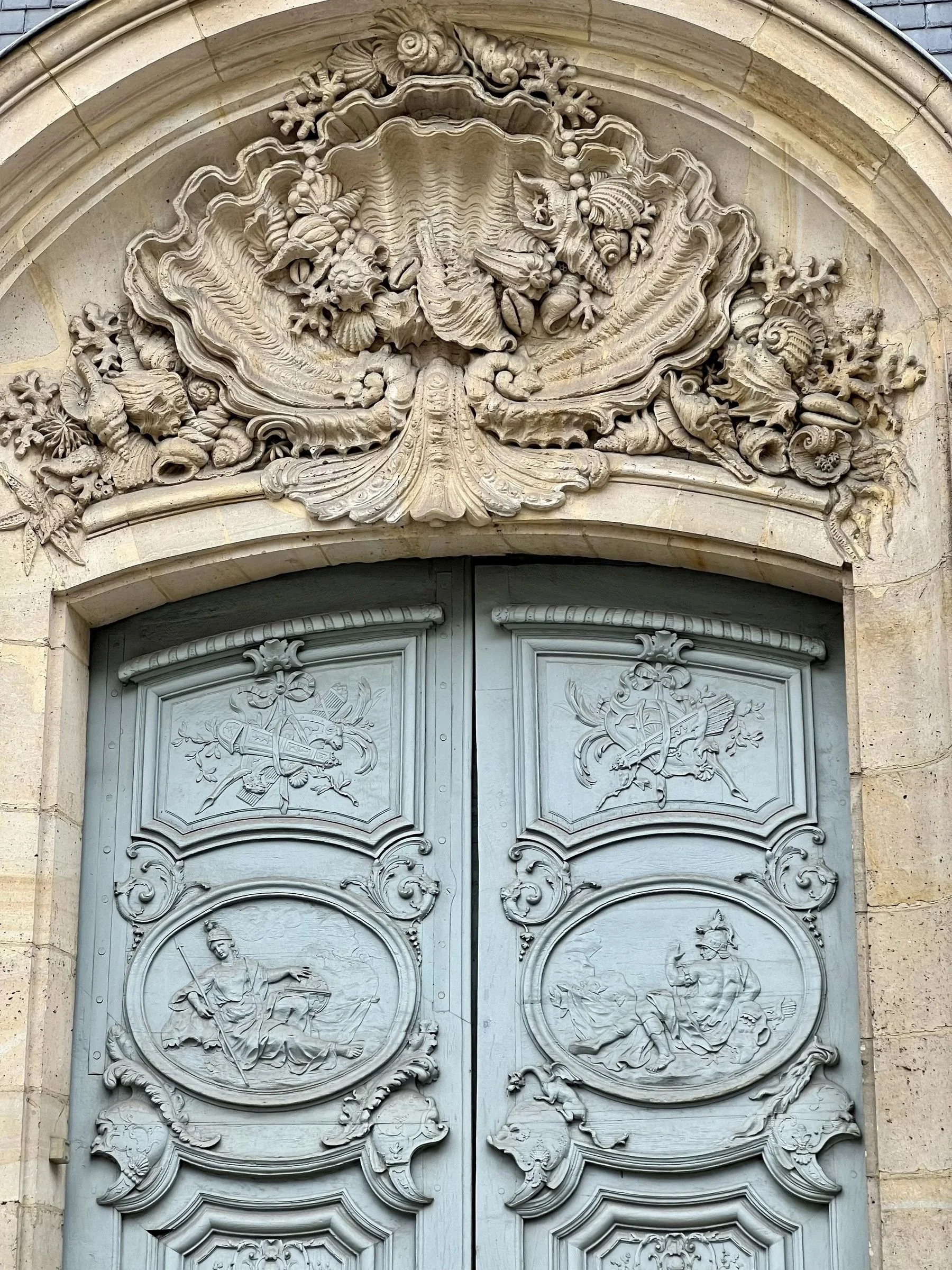 Doorway on a historic Parisian building with detailed stonework