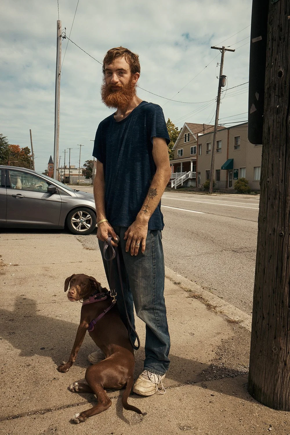 Flint_YoungMan_Dog_OnStreet.jpg