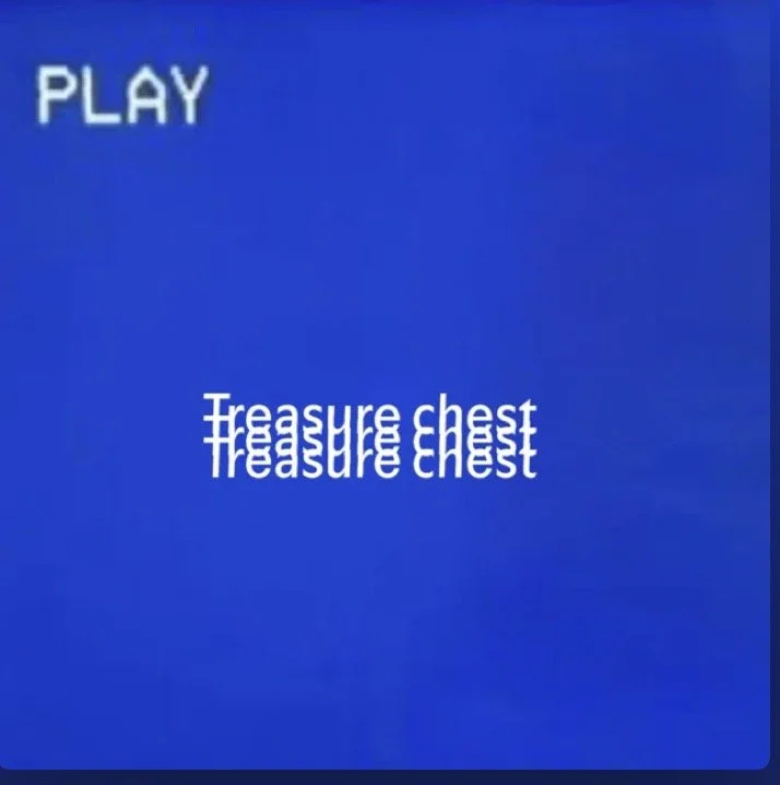A blue screen with the word 'PLAY' in the top left corner and the phrase 'Treasure chest' repeatedly displayed in the center.