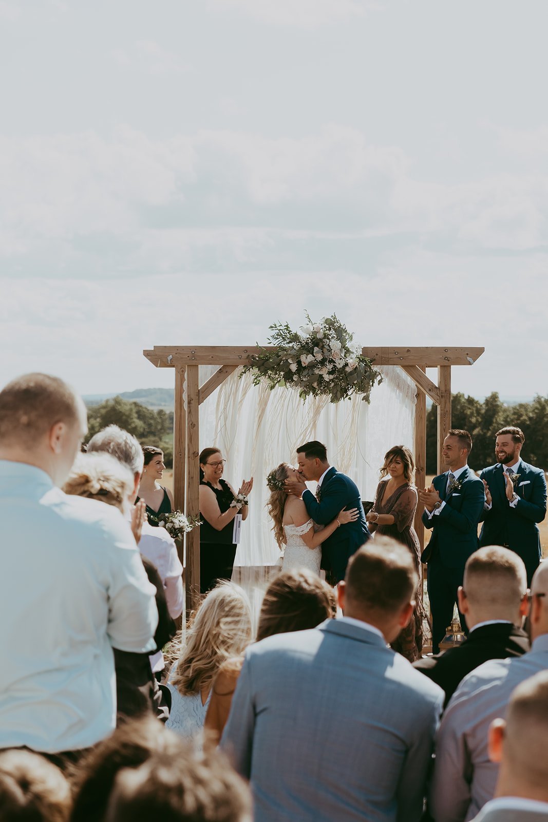 toronto-outdoor-rustic-summer-wedding-bradford-barn-ceremony-first-kiss.jpg