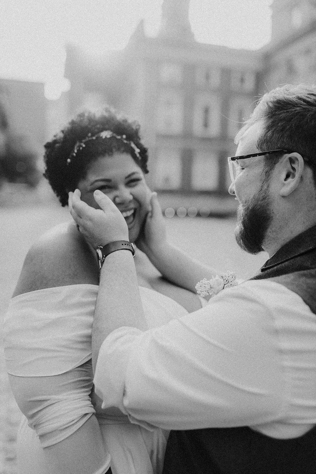 Wedding couple laughing and having fun during portraits.