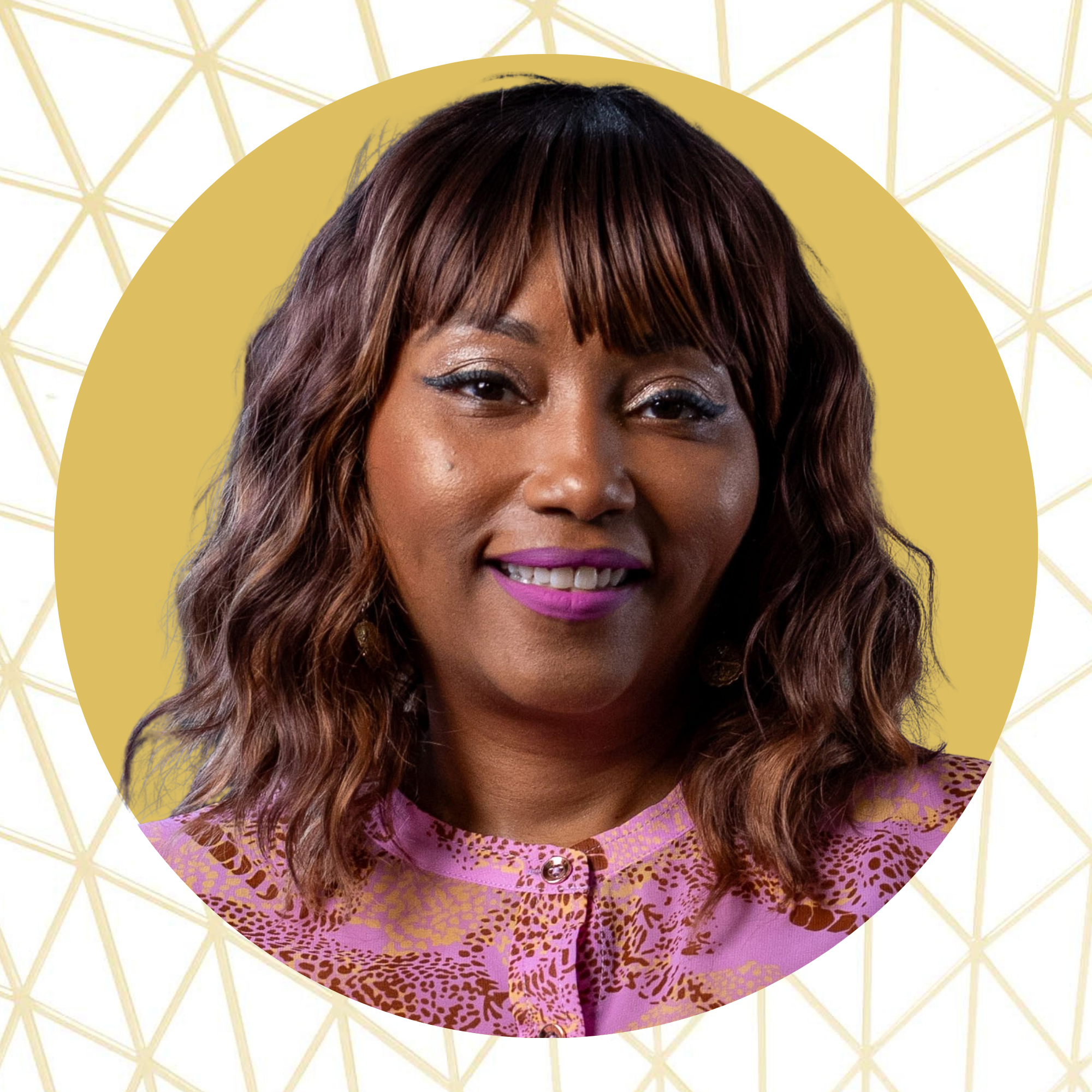 A woman with medium-length brown hair and bangs, wearing a pink and purple animal print top, smiling with pink lipstick, against a gold and white geometric patterned background.