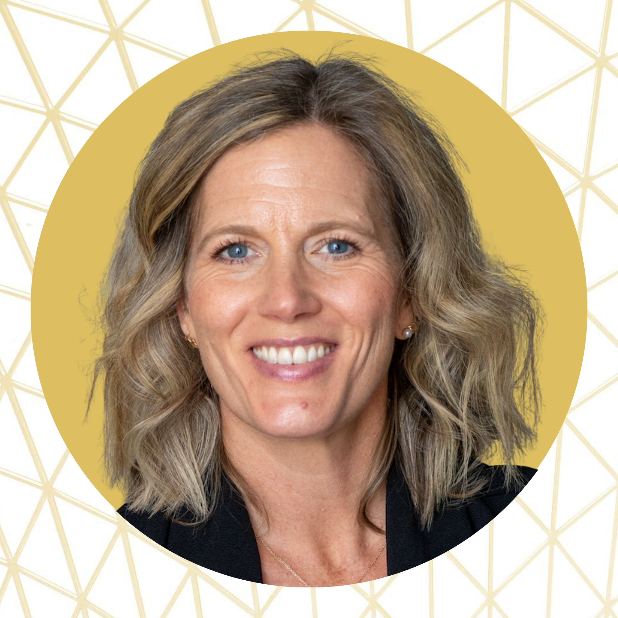 A woman with shoulder-length wavy blonde hair, blue eyes, and a bright smile, wearing earrings and a black top, with a yellow circular background and white geometric pattern behind her.