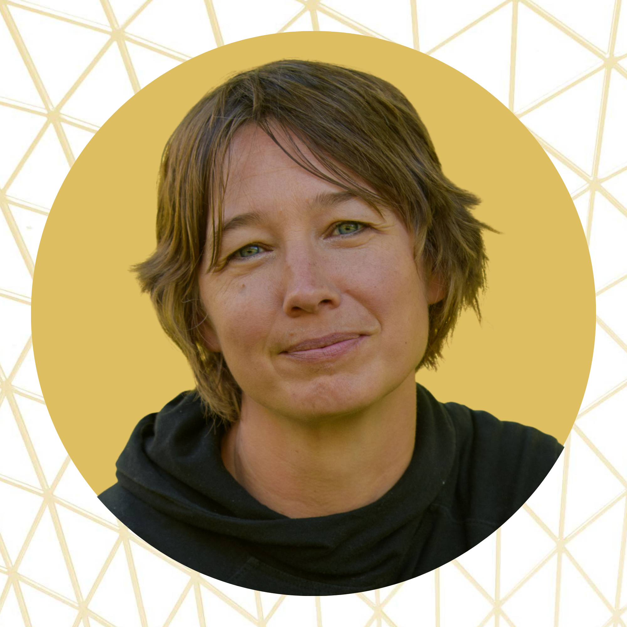 Close-up of a woman with short, tousled brown hair and green eyes, wearing a black top, against a yellow background with a white geometric pattern.