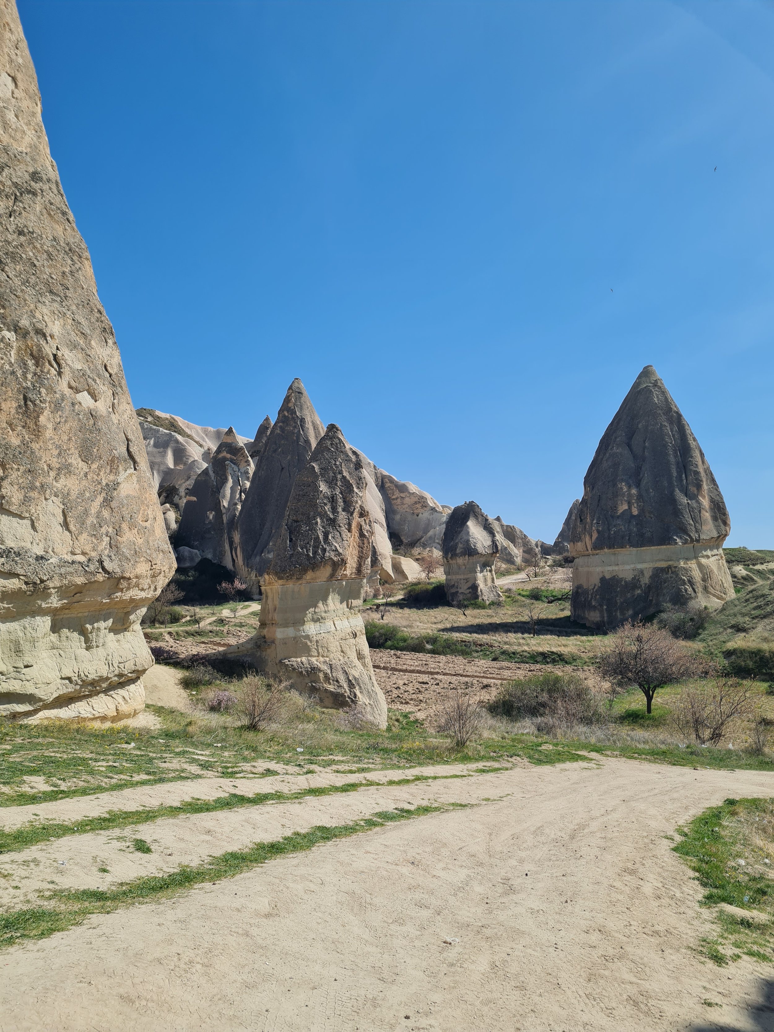 SWORD VALLEY. You'll be able to see Goreme in the distance towards the right. Walk straight through Sword Valley and probably past some ATVs to join the dirt road leading into Goreme.